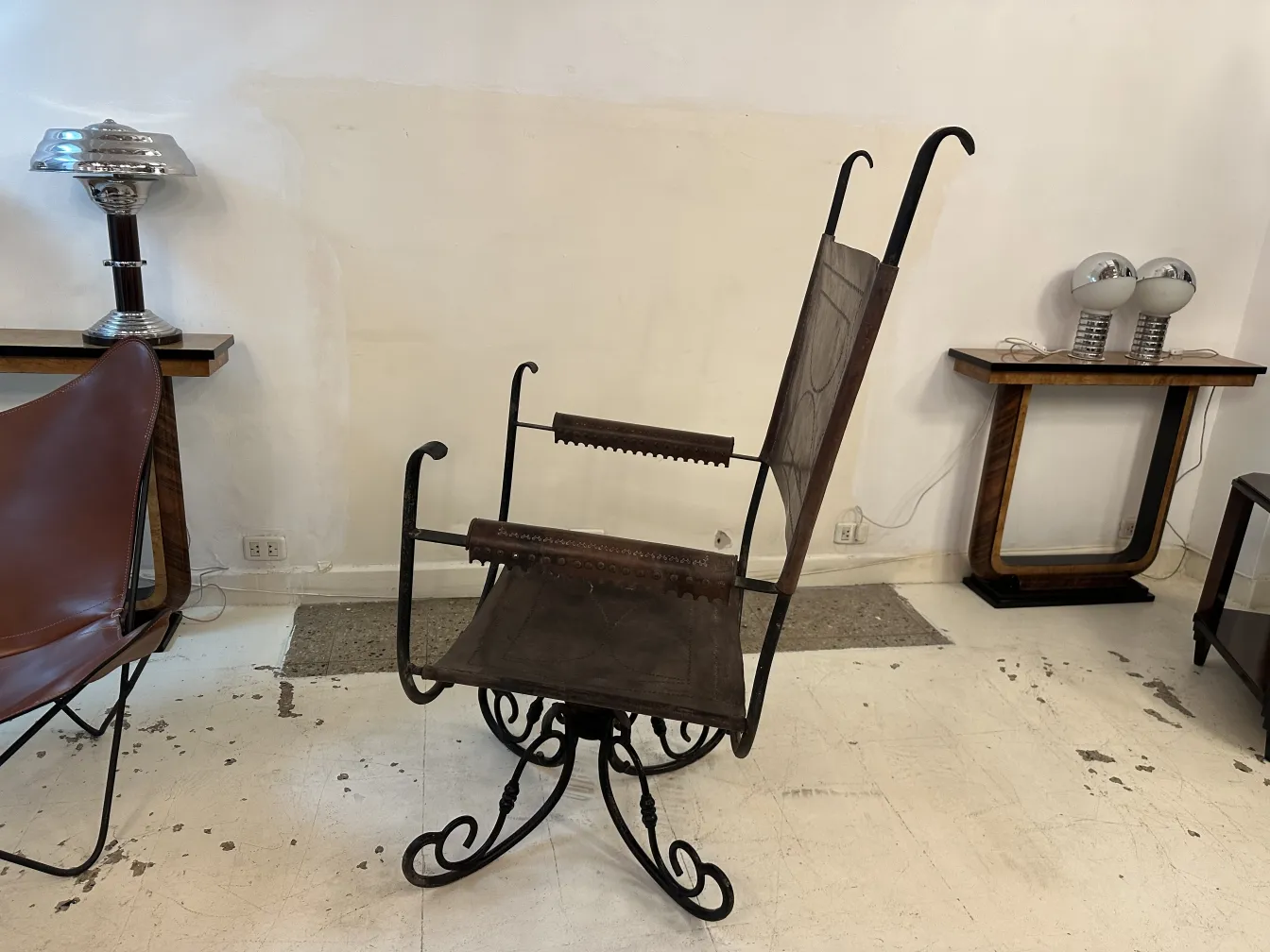 Antique art deco armchair with unique details in a modern setting.