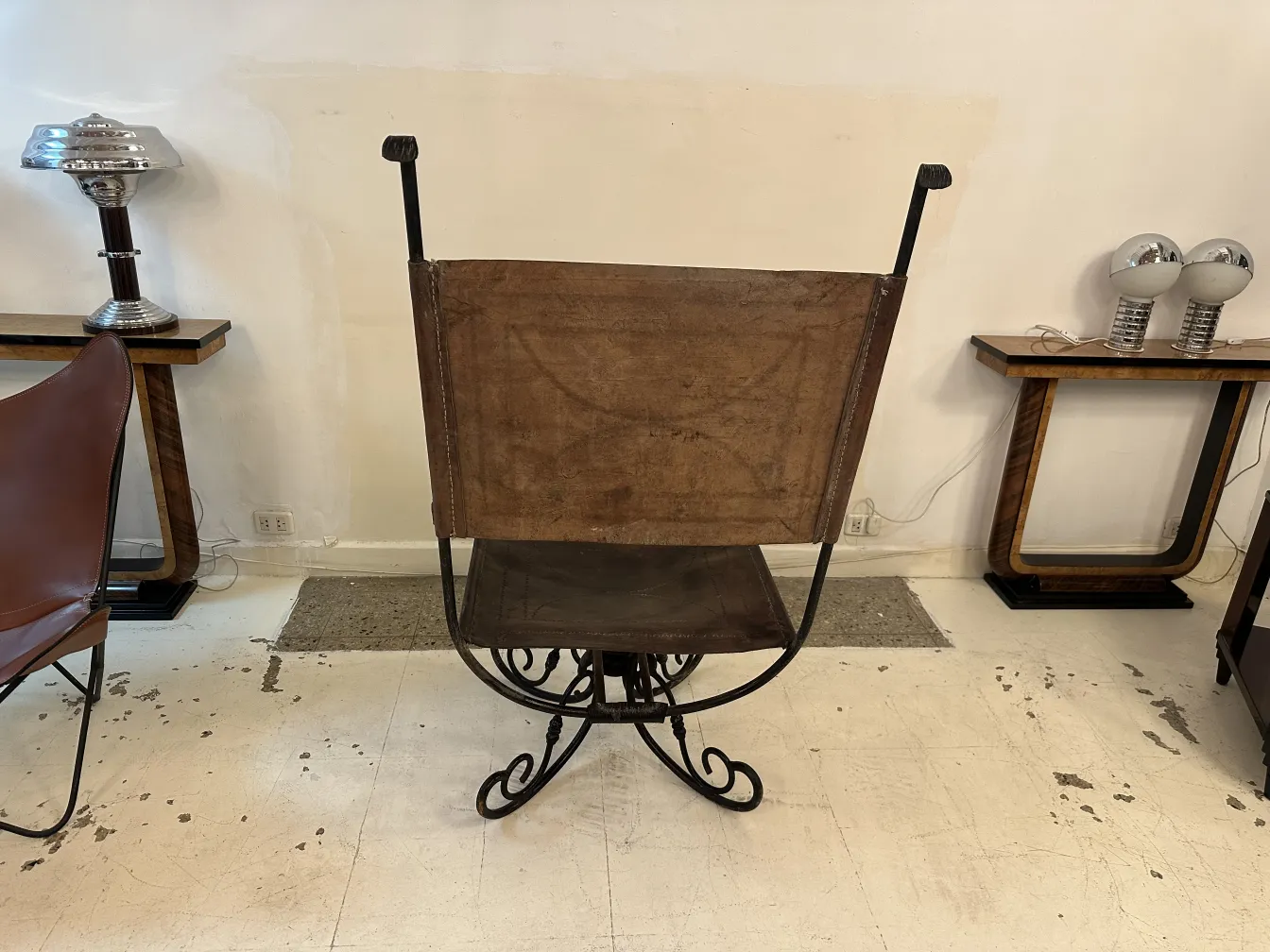 Antique armchair with classic design in decorative setting.