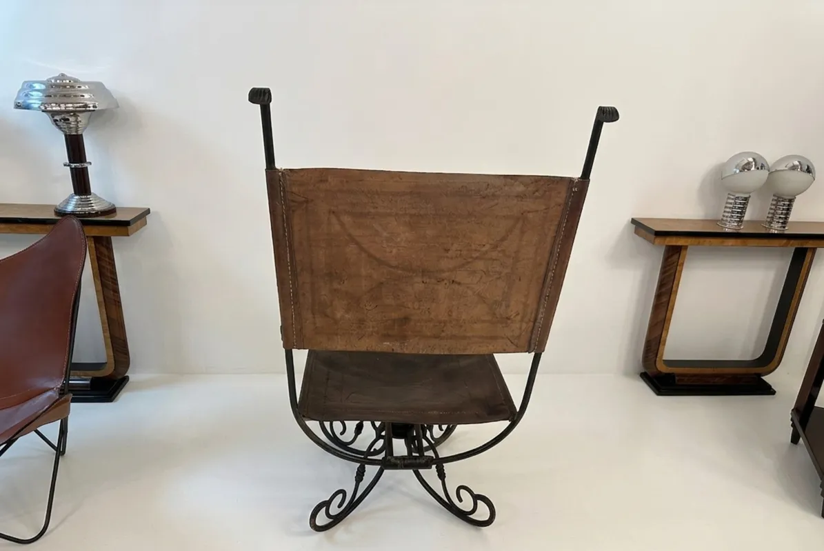 Antique armchair with artistic design in a modern environment.