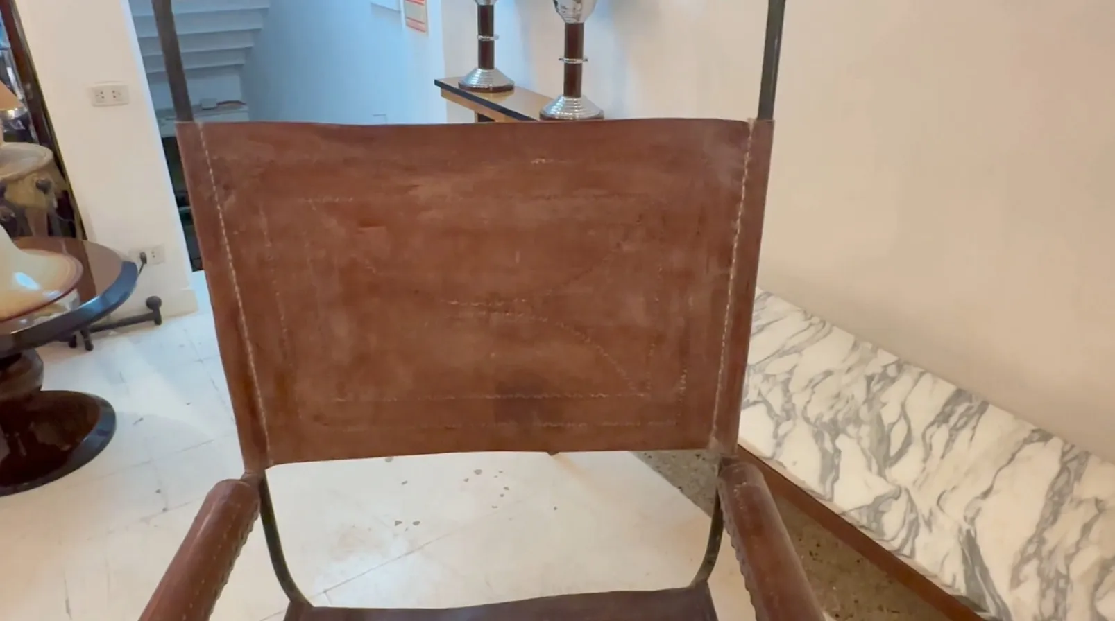 Antique armchair featuring art deco details in an elegant setting.