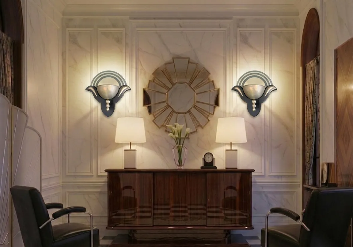 Antique pair of sconces in Art Deco style illuminating an elegant living room.