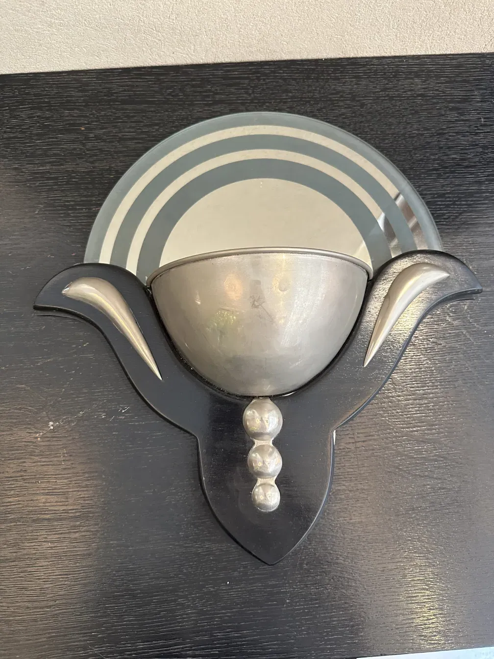 antique sconces featuring decorative design and unique details