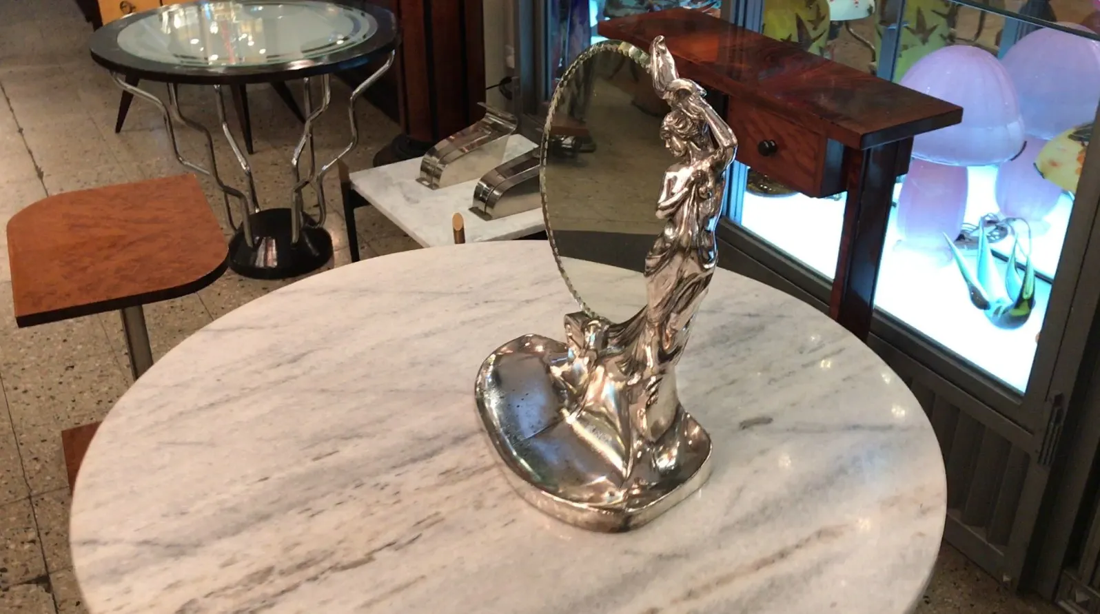 antique mirror with decorative figure, silvered surface
