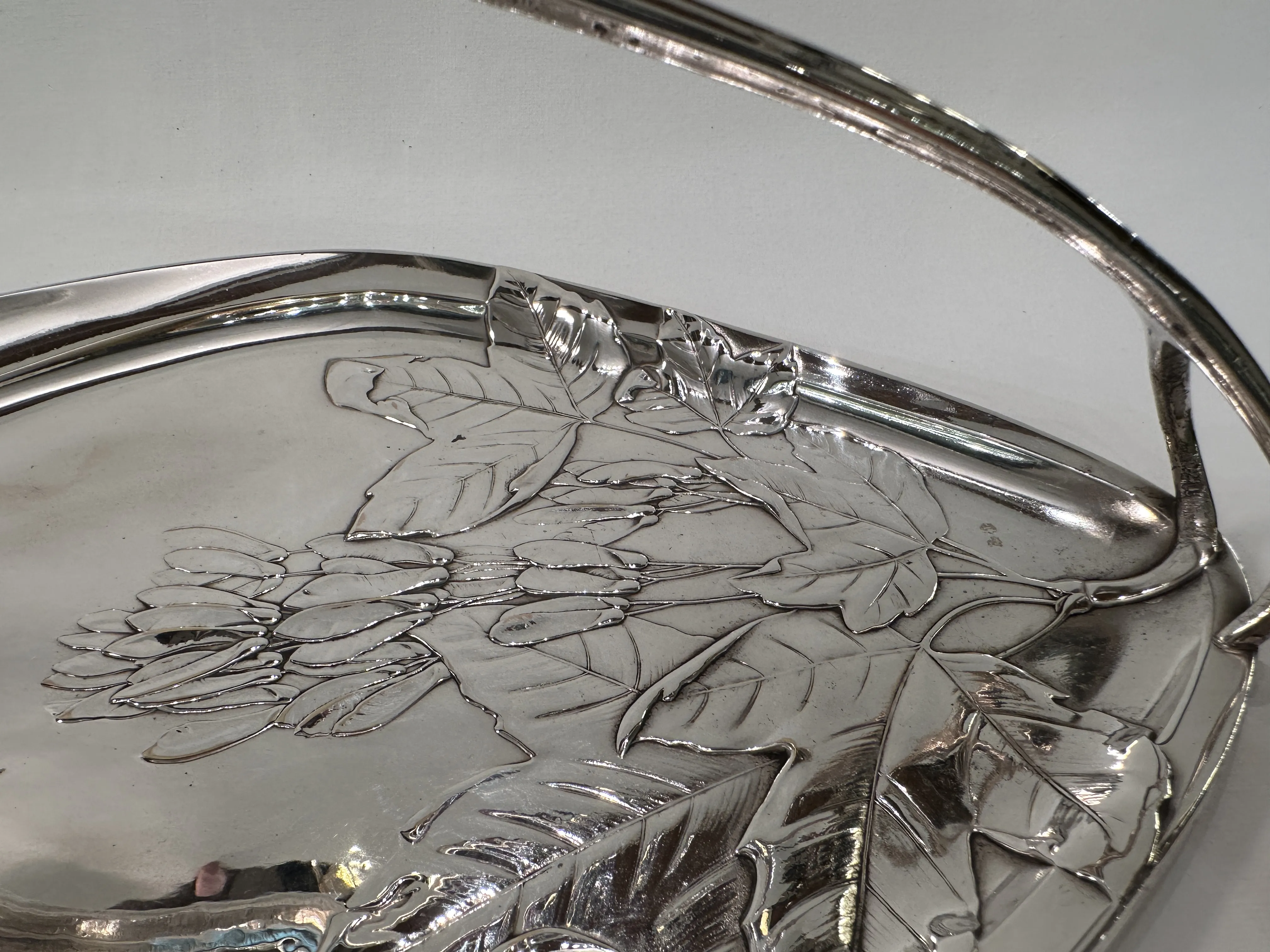 antique WMF card tray featuring floral engraving