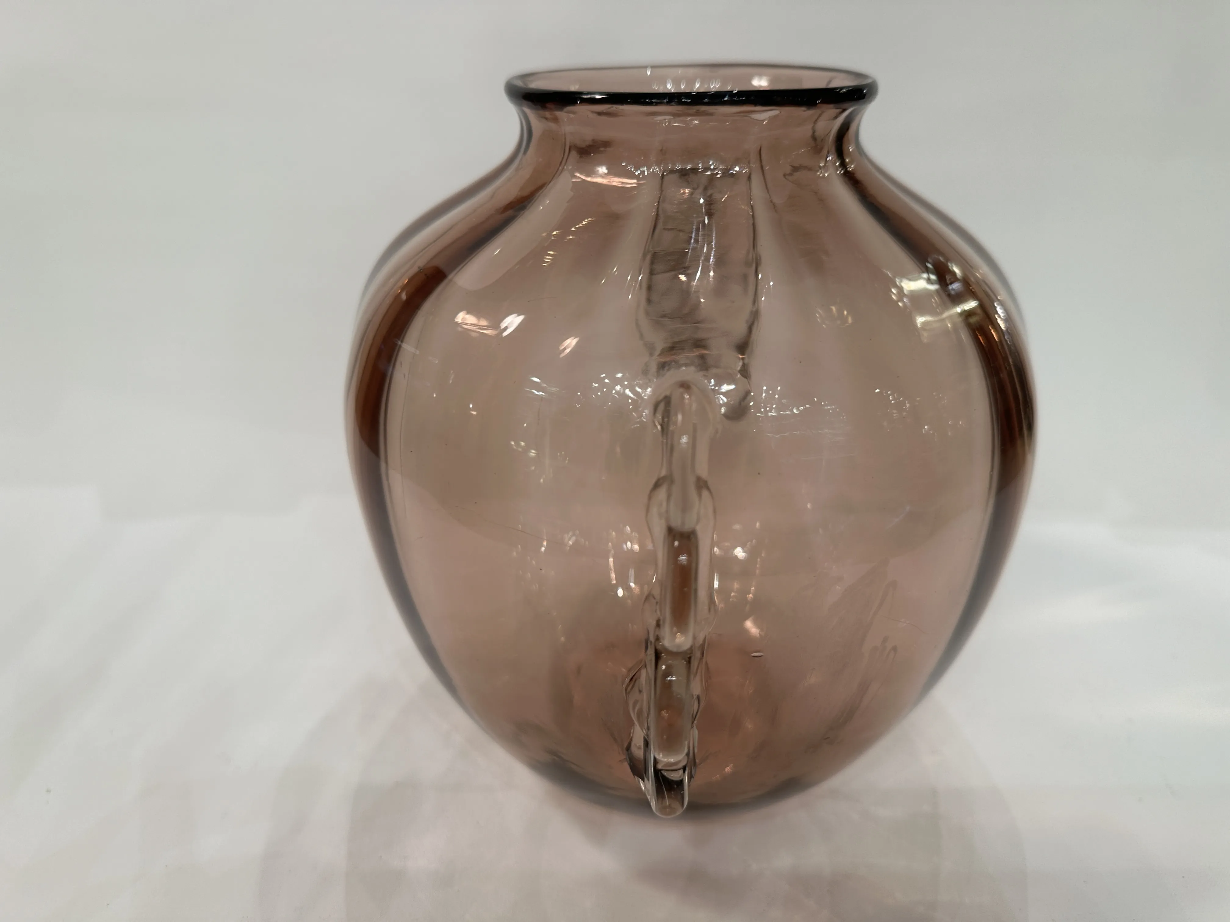 antique murano vase with delicate and elegant design, brown color, set against a light background