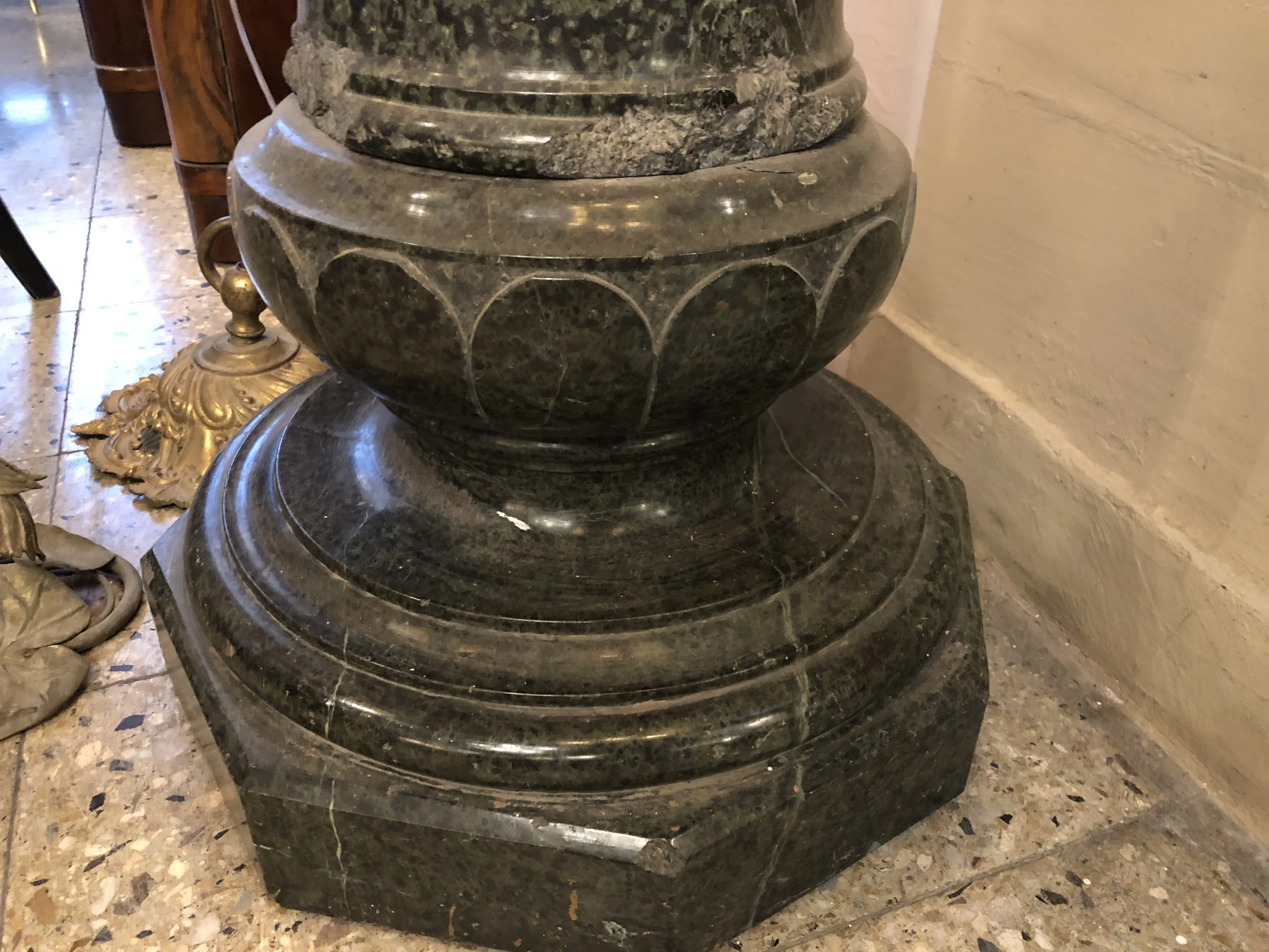 Detail of an antique column with an octagonal base in a classic setting