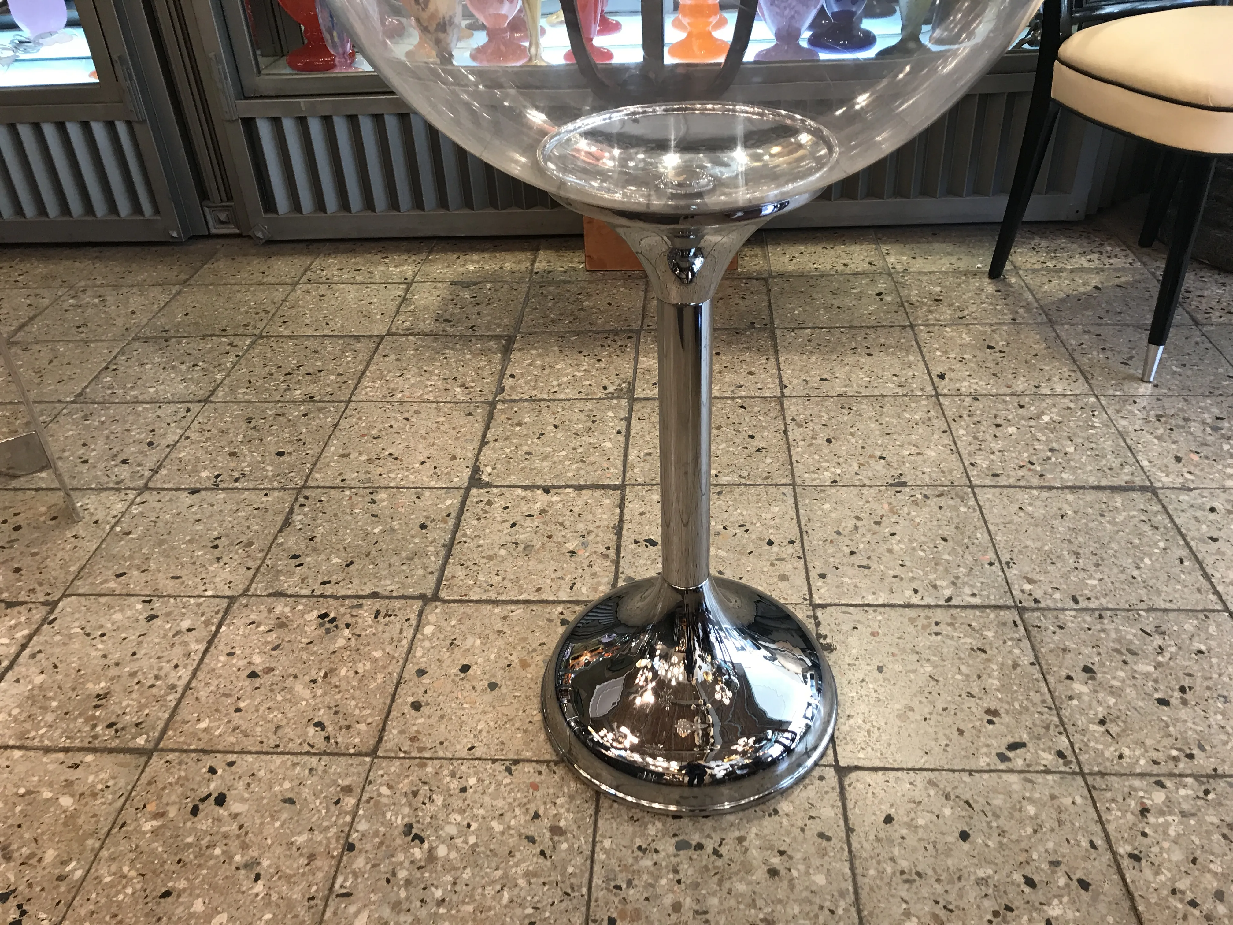 Antique champagne cooler with a glossy finish in a modern setting.