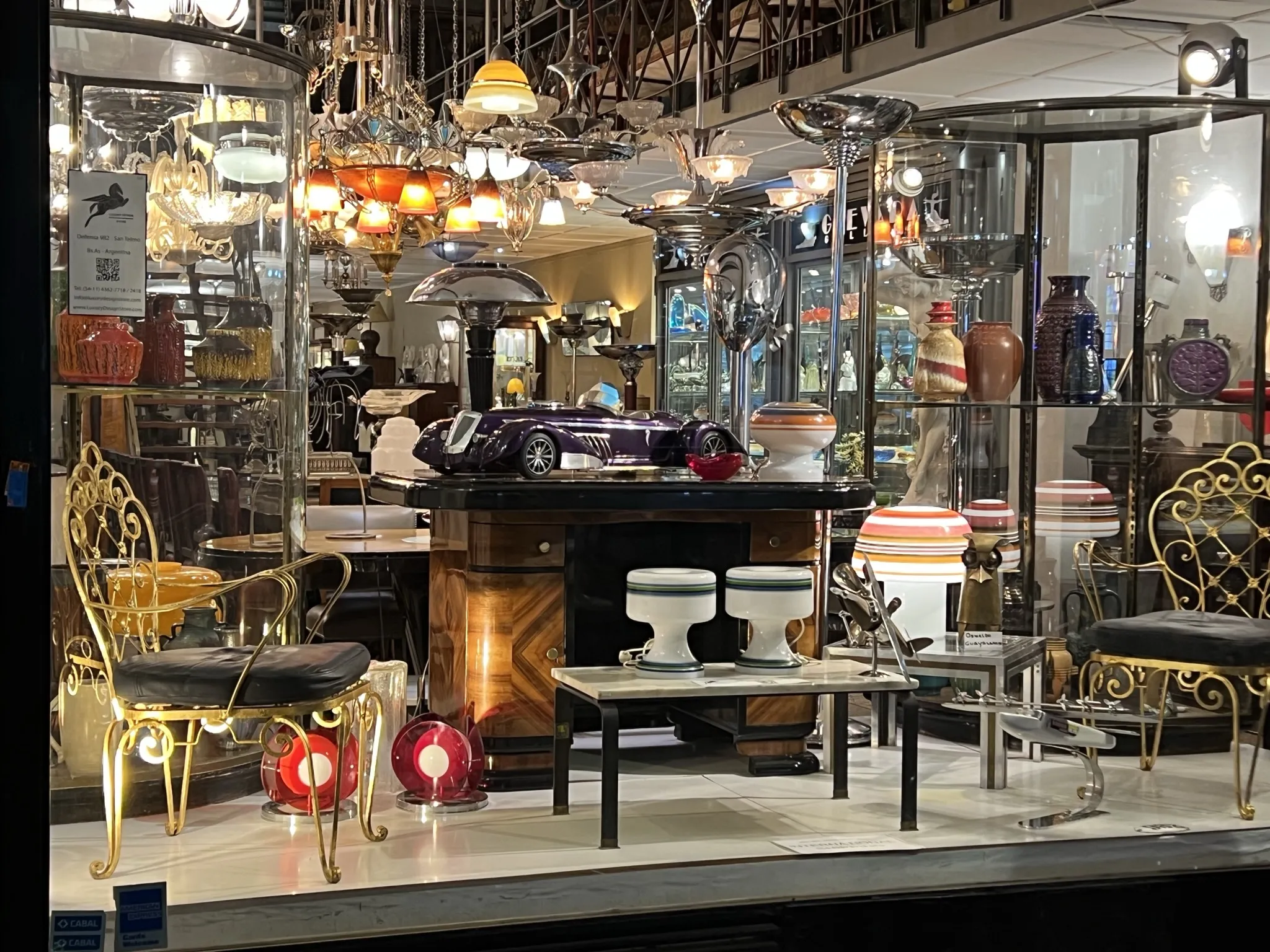 Antique coffee table surrounded by vintage decor and light fixtures