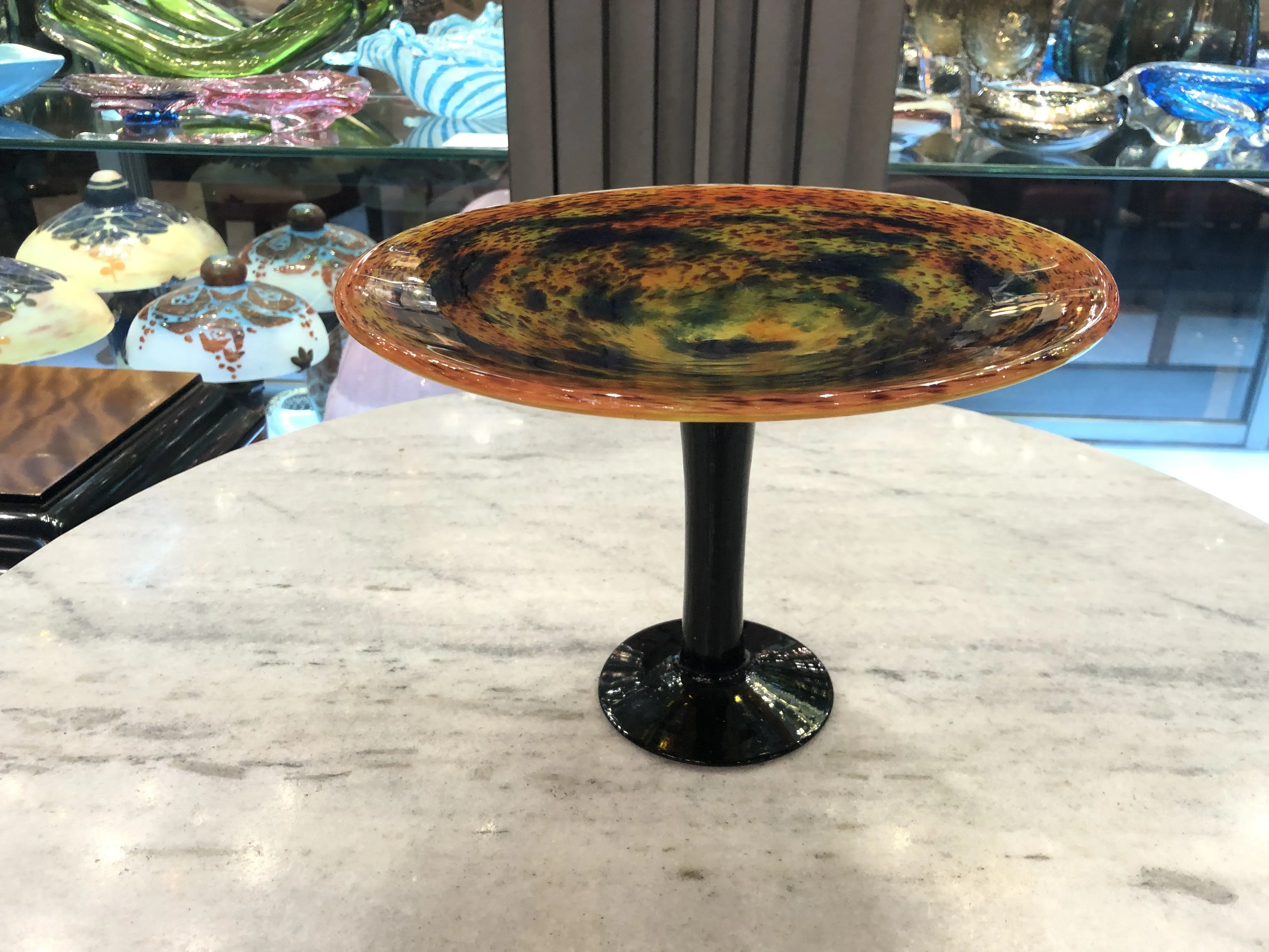Decorative signed glass Schneider with black base