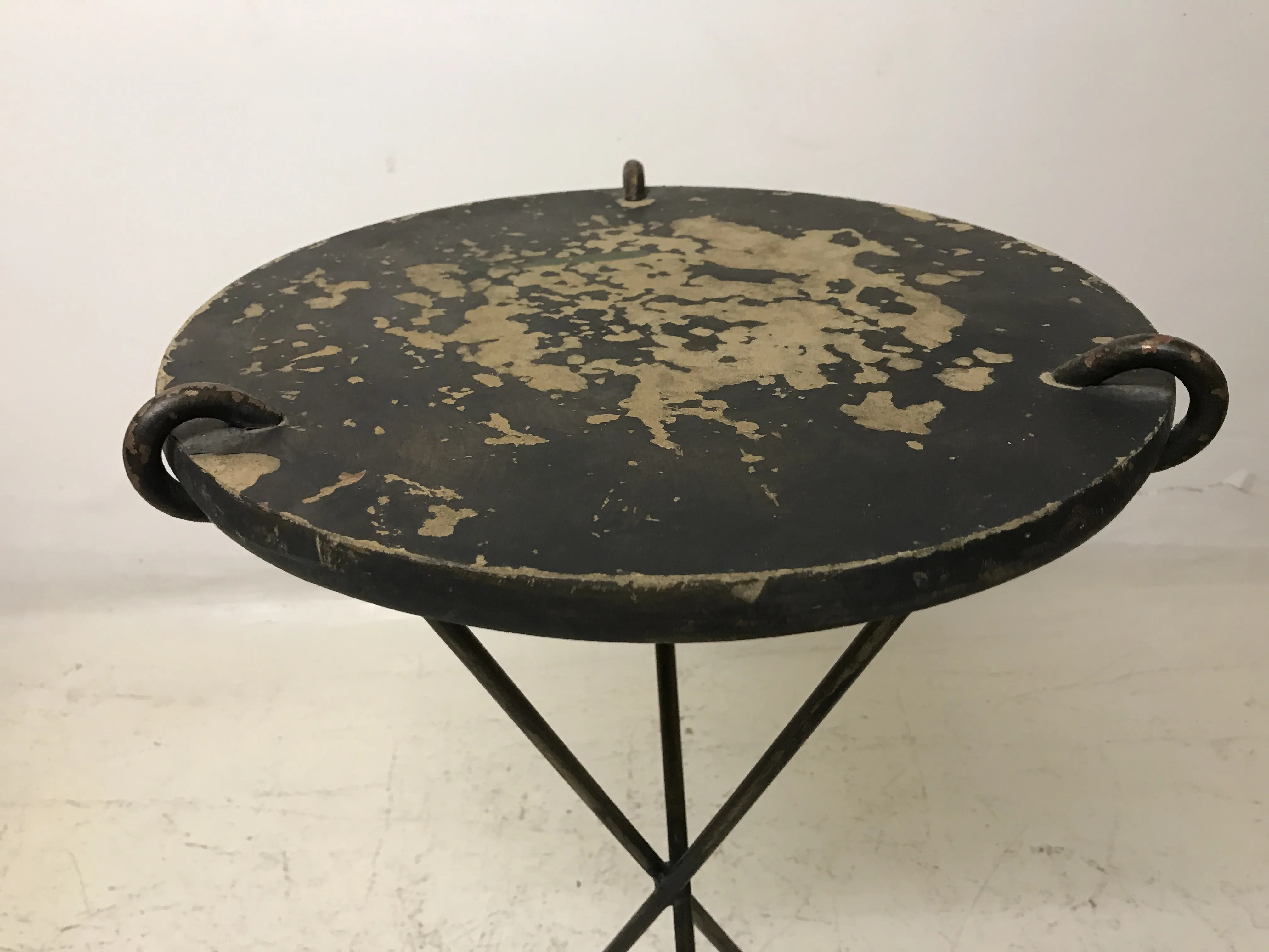 antique black small table with worn golden details and legs
