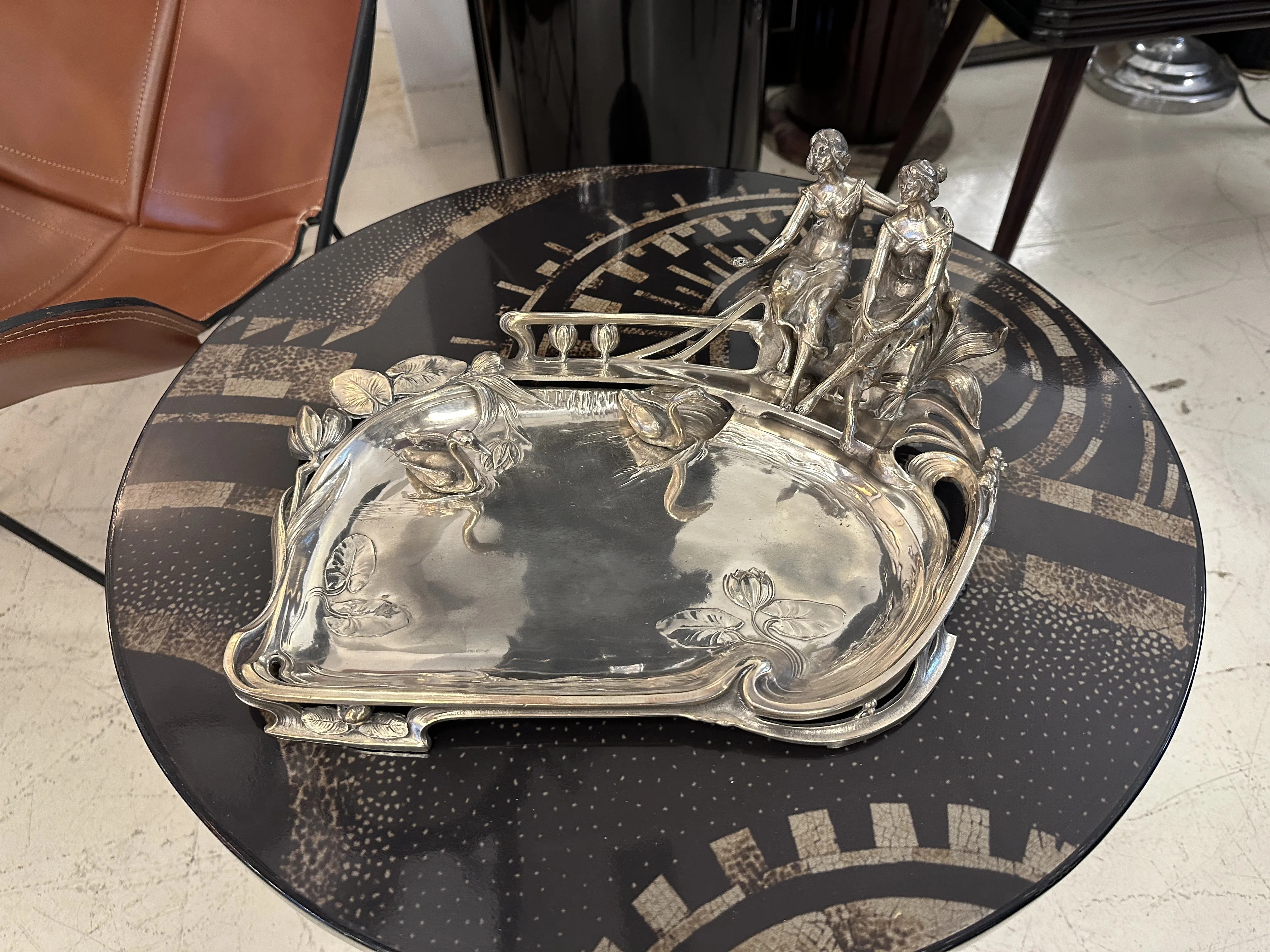 antique WMF card tray with decorative details and figures