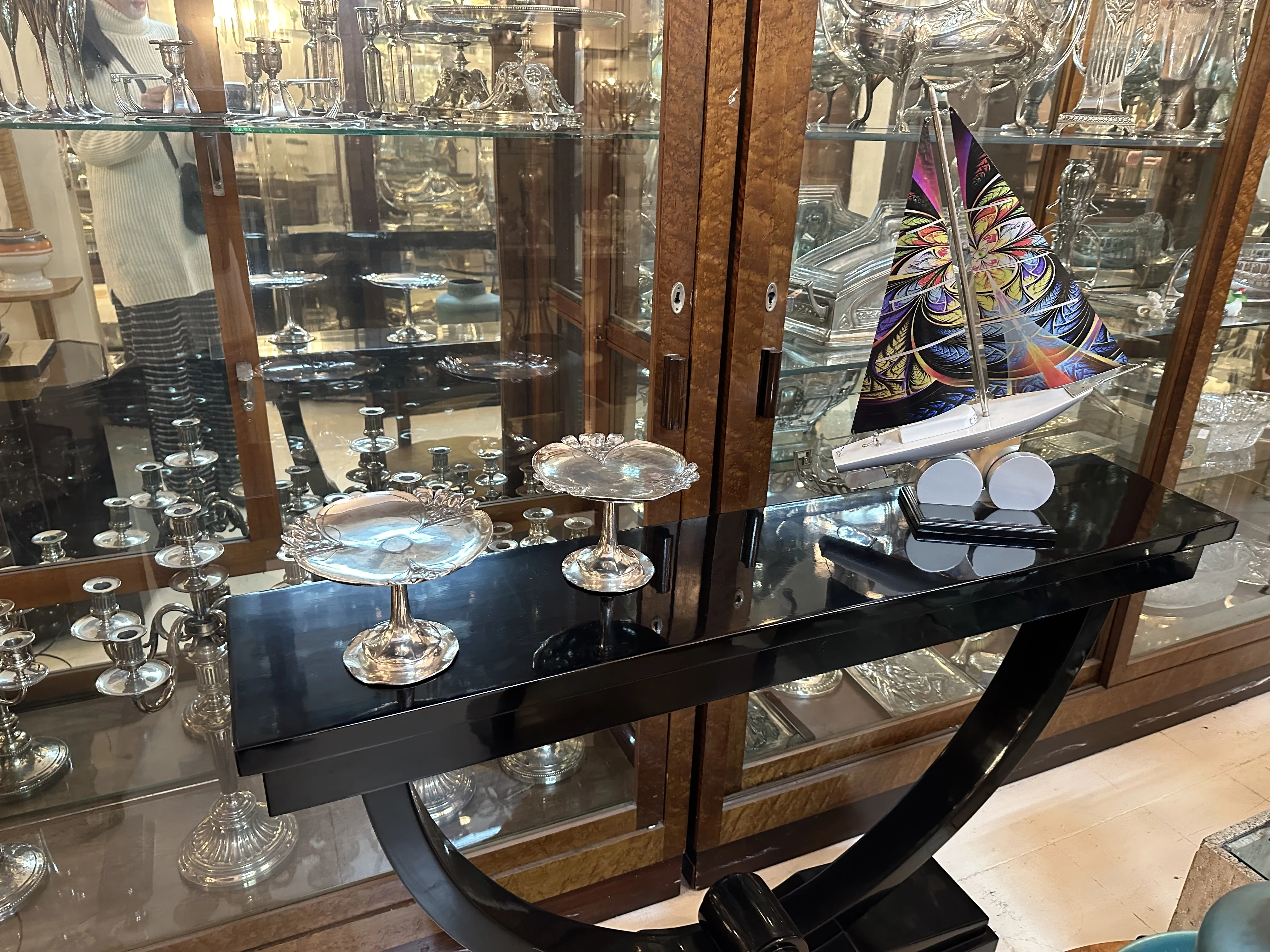 Antique card tray WMF with an elegant design, surrounded by decorative items.