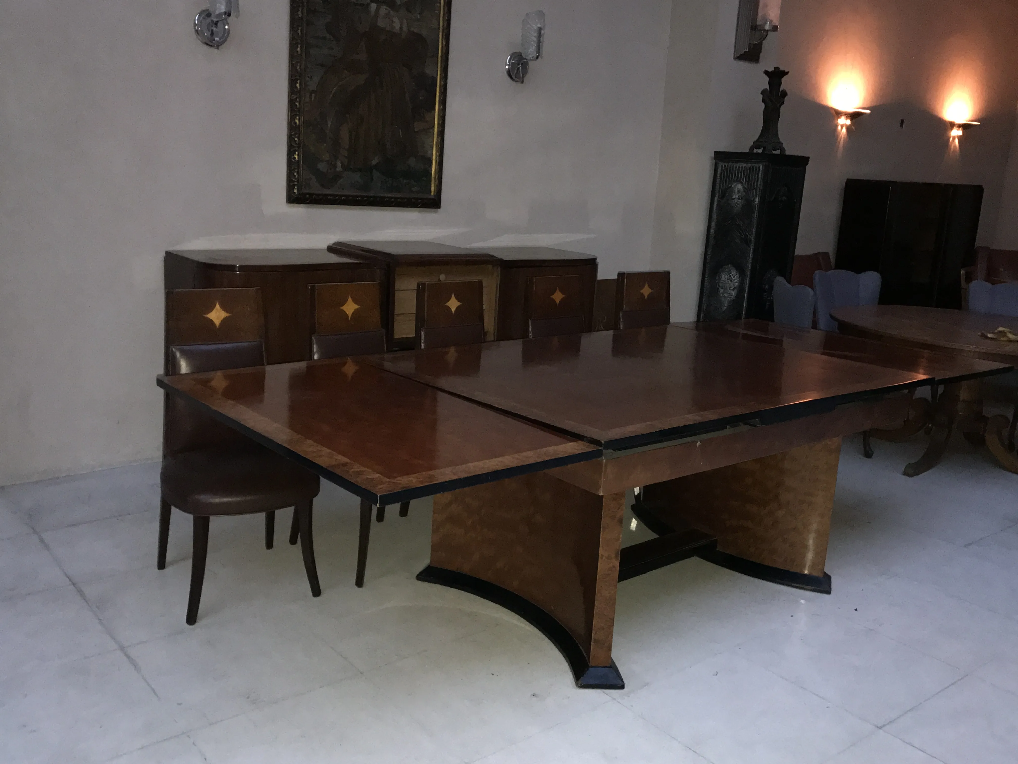 antique art deco dining table in an elegant setting with chairs