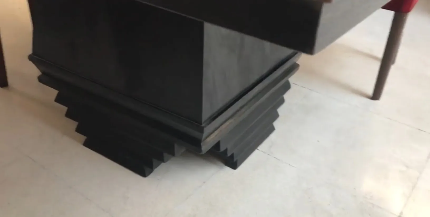 Antique dining table for 8 people with stylized base and Art Deco detail.