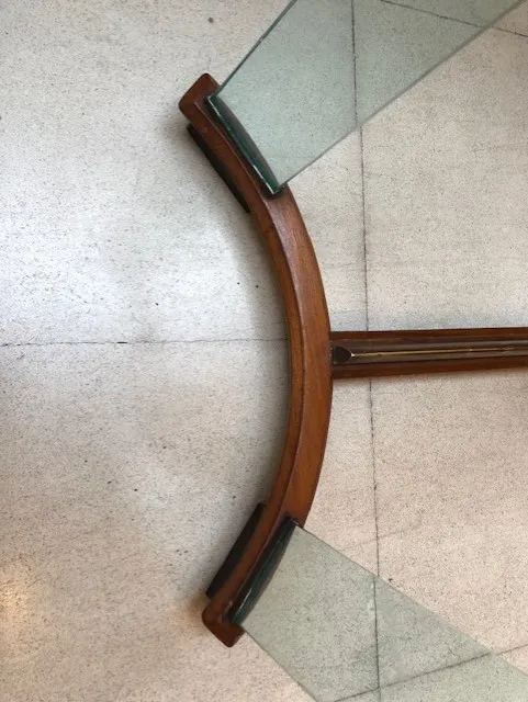 antique table with a curved shape and glass top, elegant setting