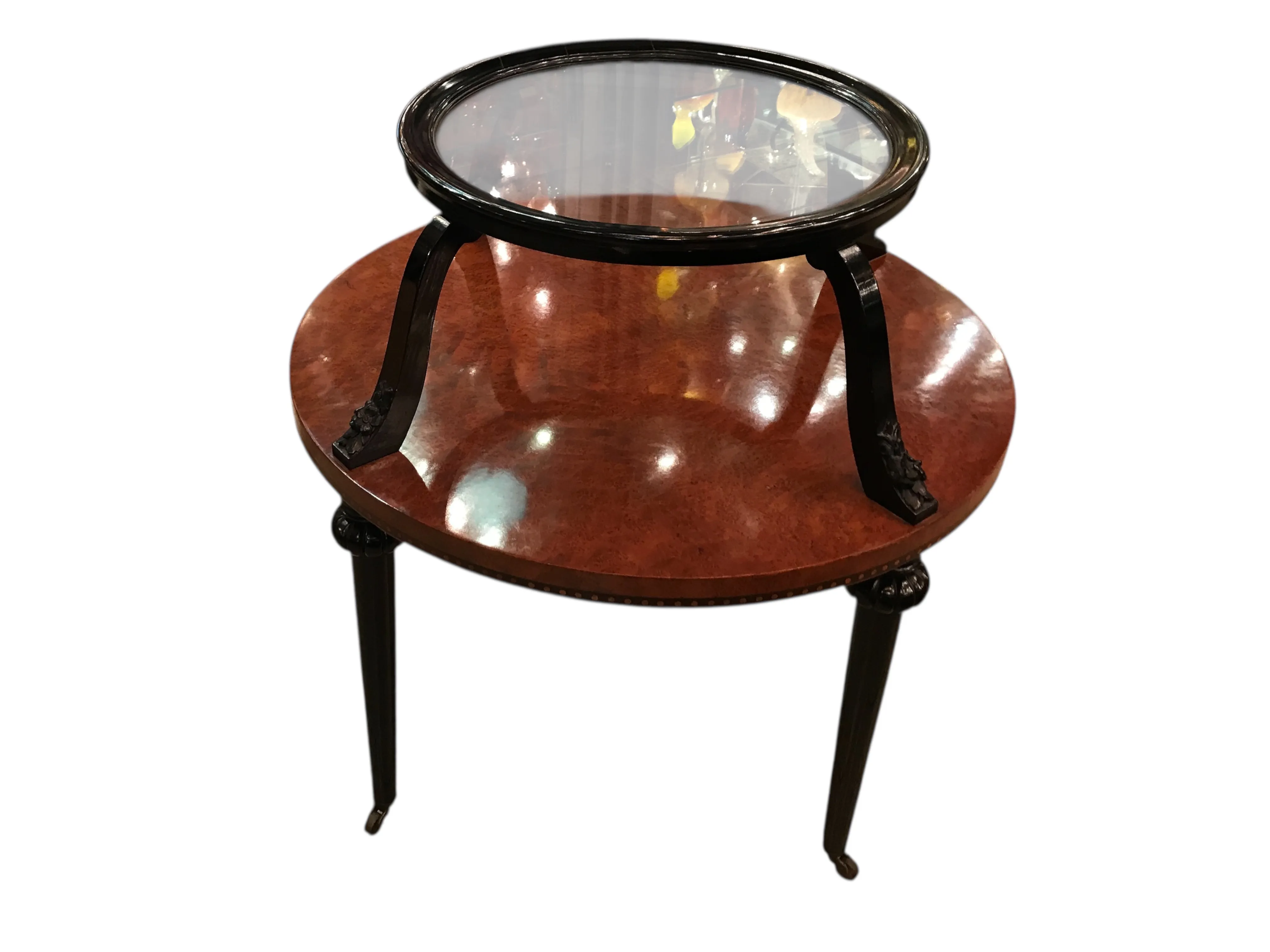 Antique small table with a circular glass top and elegant legs