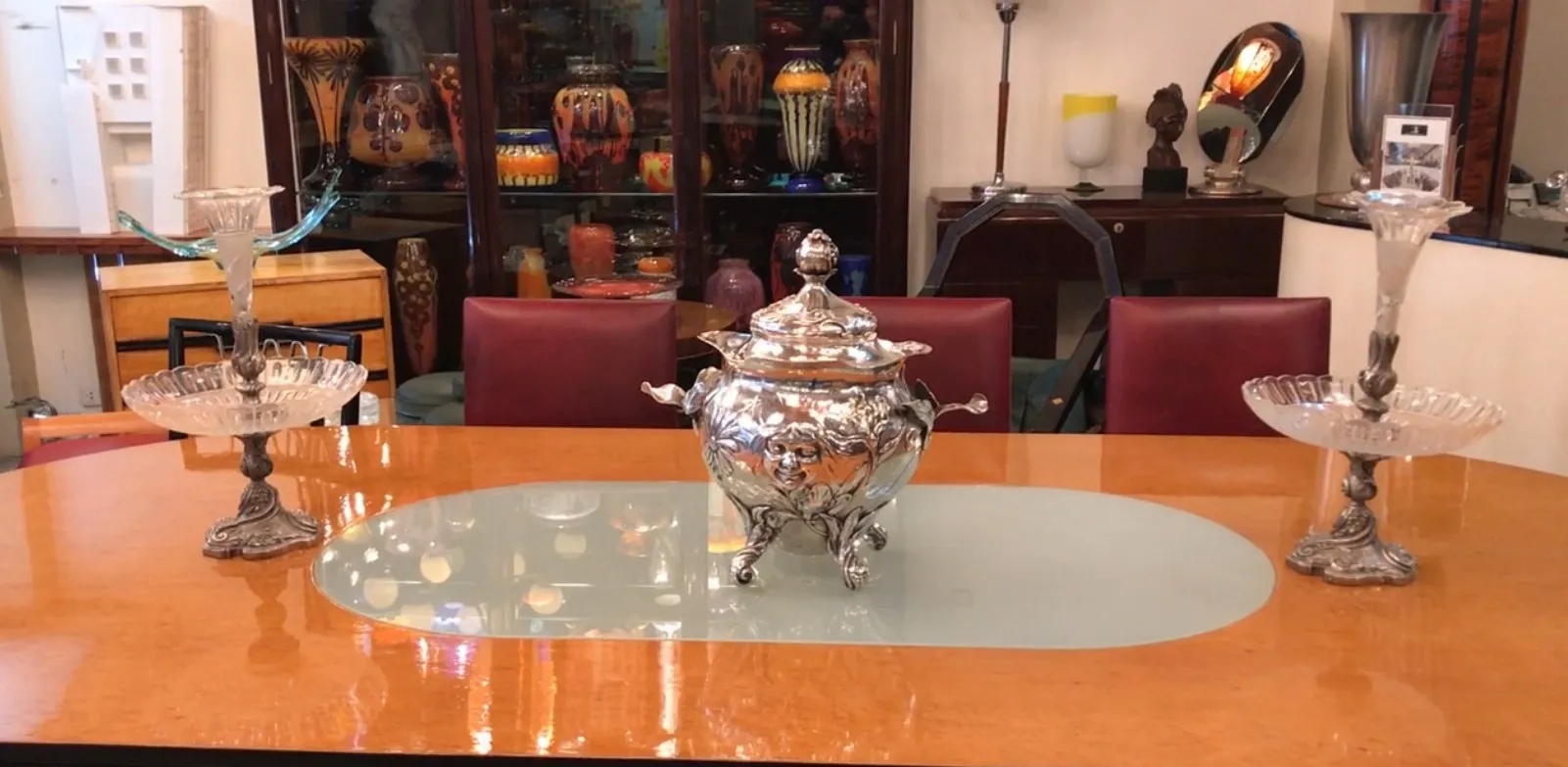 Antique WMF punch bowl with ornamental details in an elegant setting.