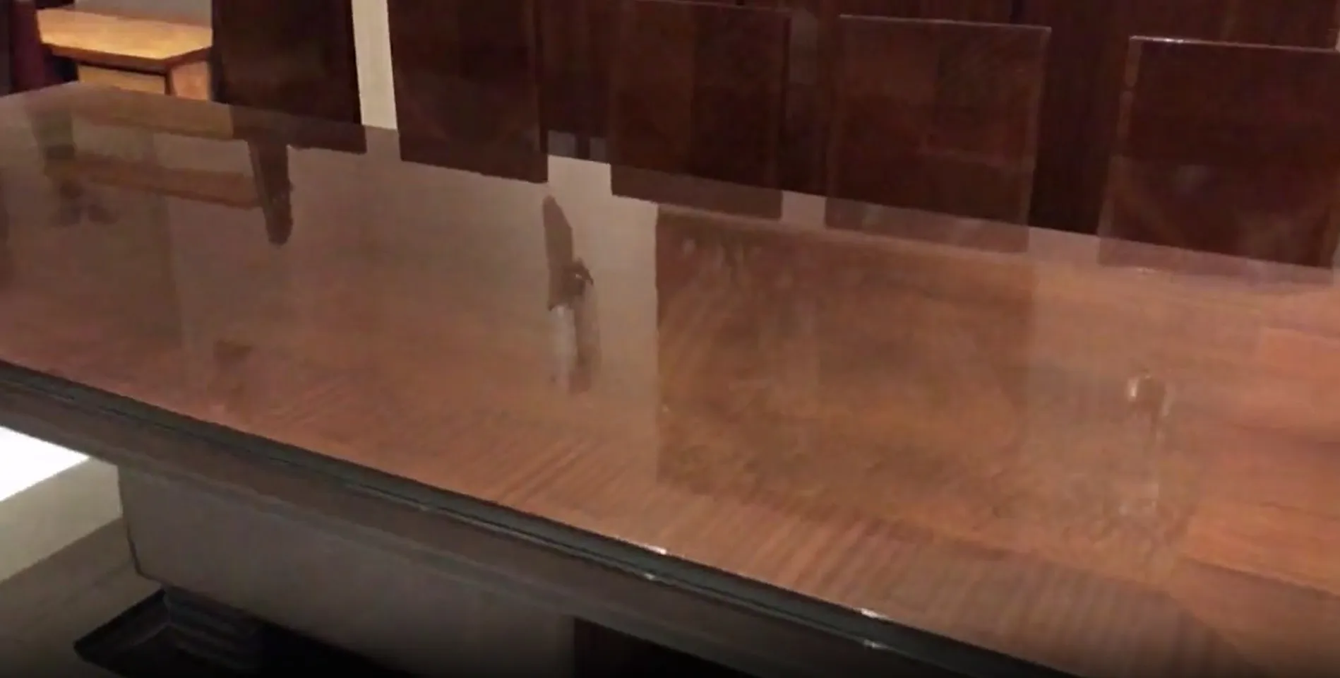 antique dining table for 10 people with surrounding chairs