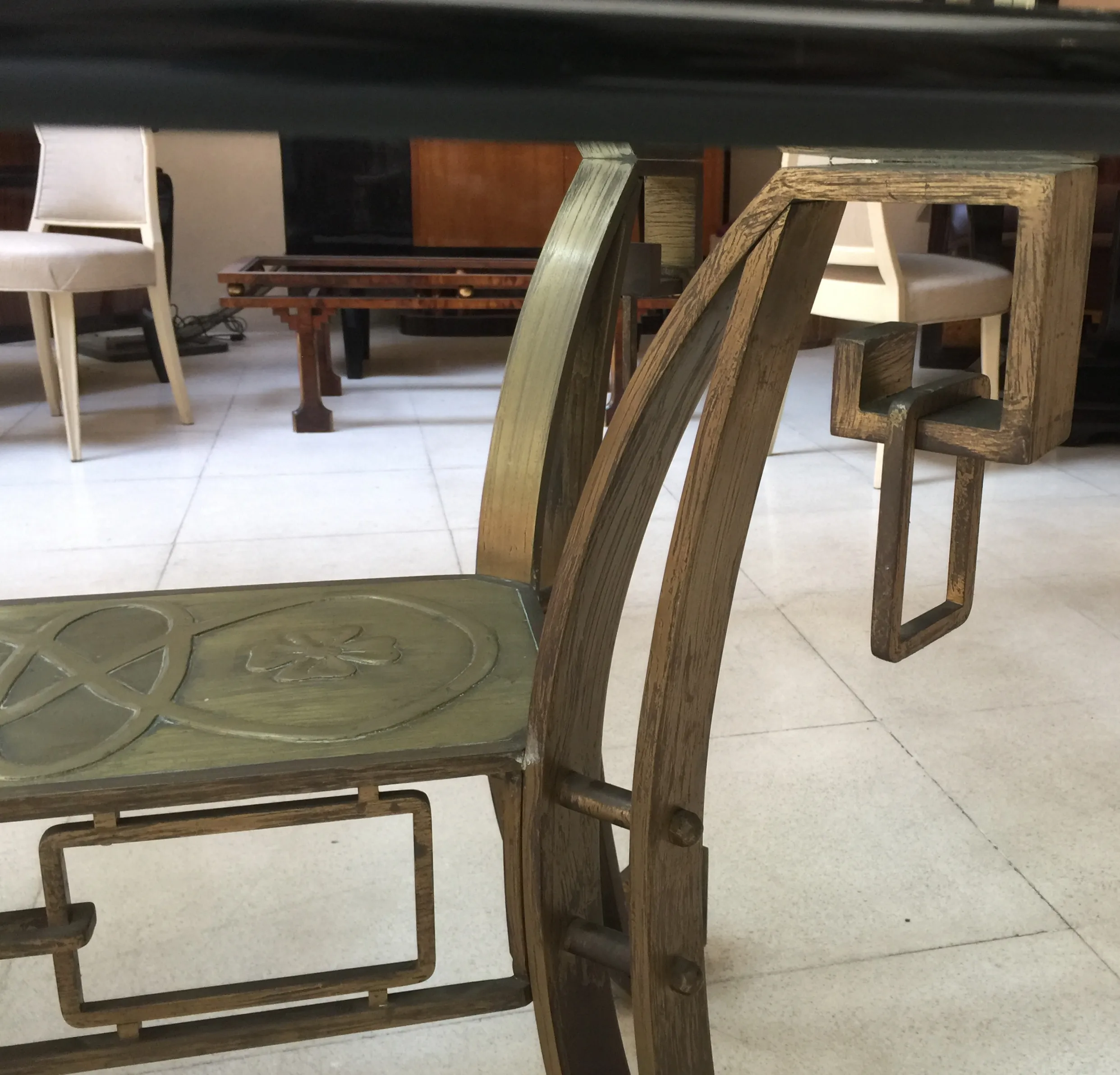 Antique Art Deco dining table for 10 in a stylish setting.