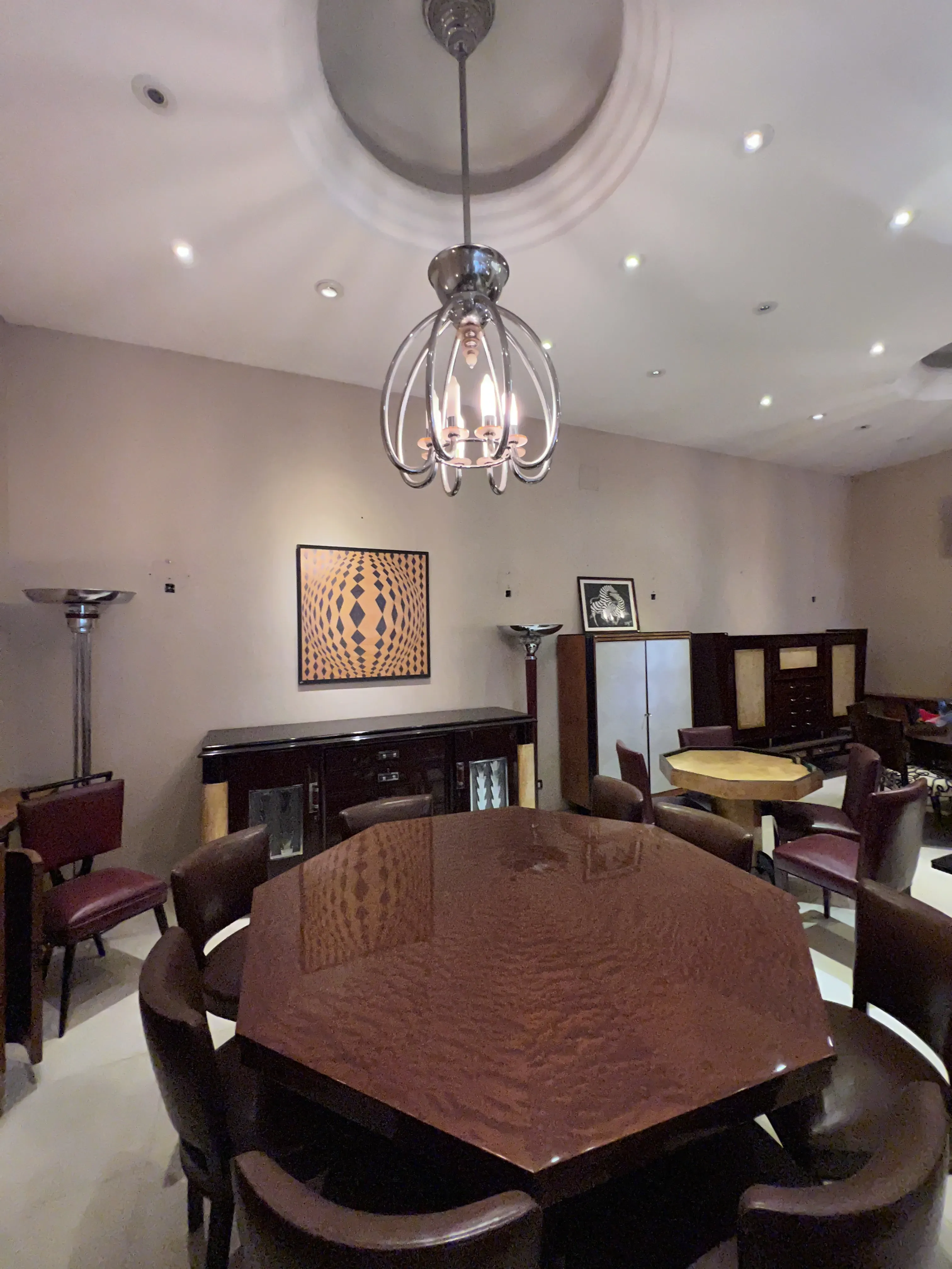 Antique Art Deco dining table for eight people in a stylish setting.