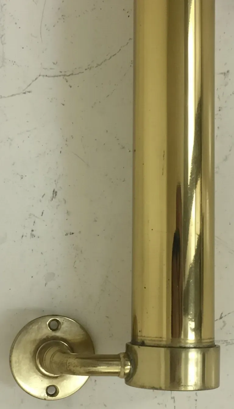 antique golden door handle with elegant design mounted on wall
