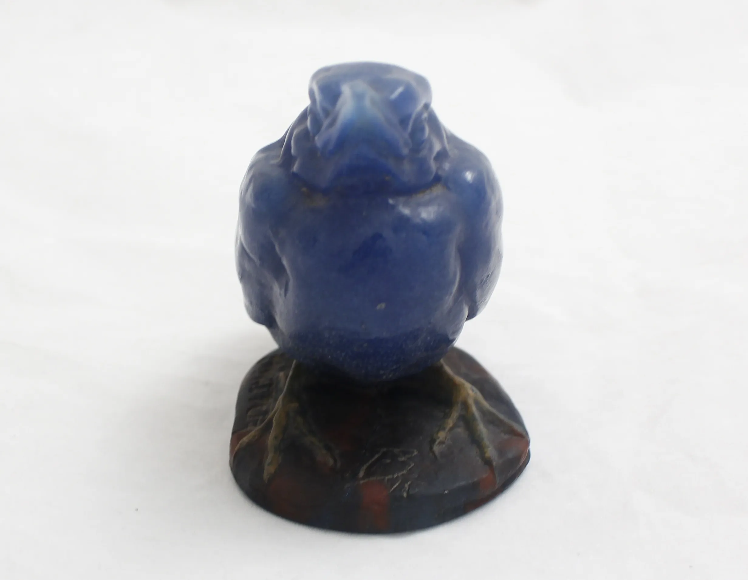Antique blue glass figure with dark base