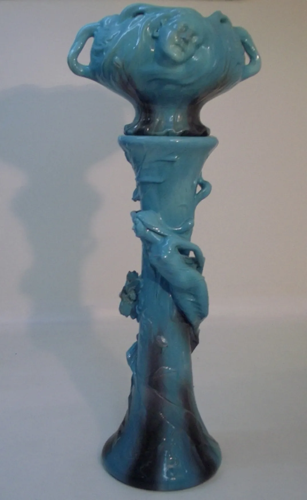antique blue planter with detailed decoration and figures