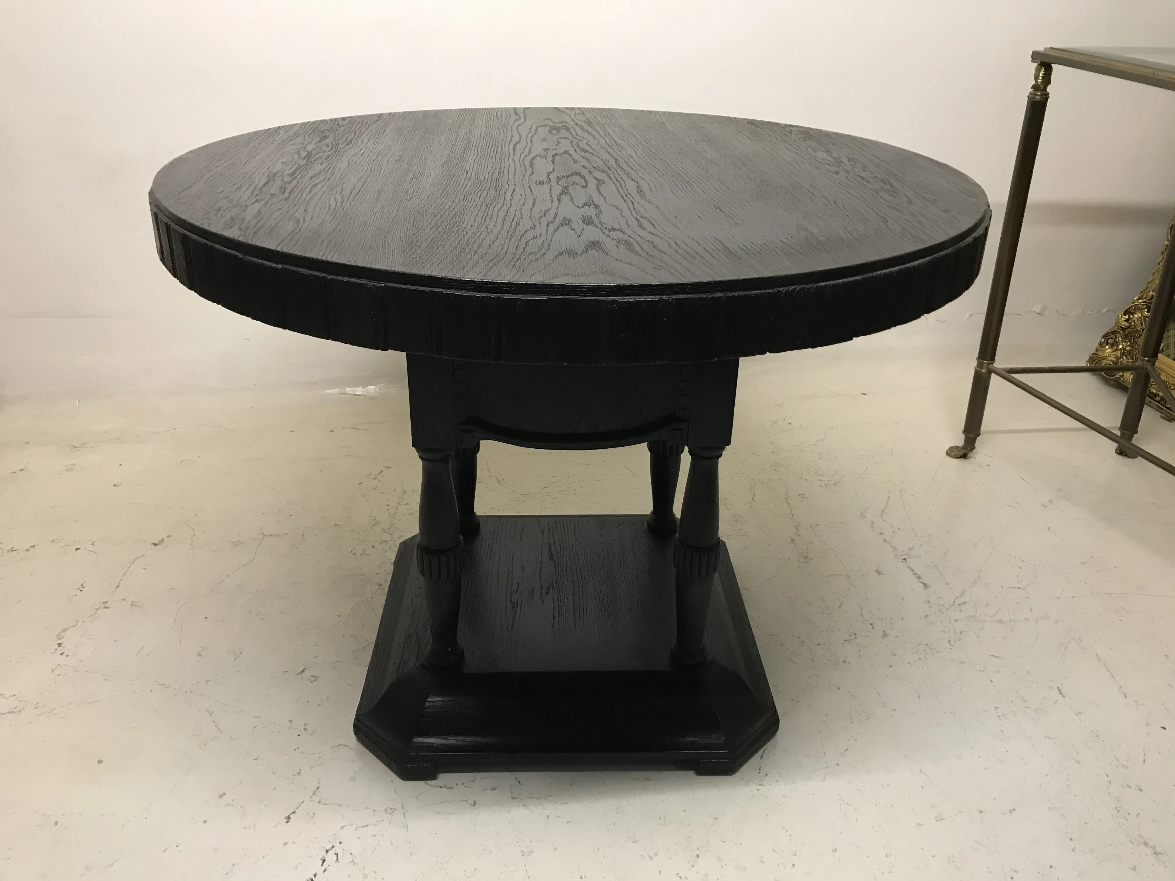 round antique table by jean michel frank for two in an elegant setting.