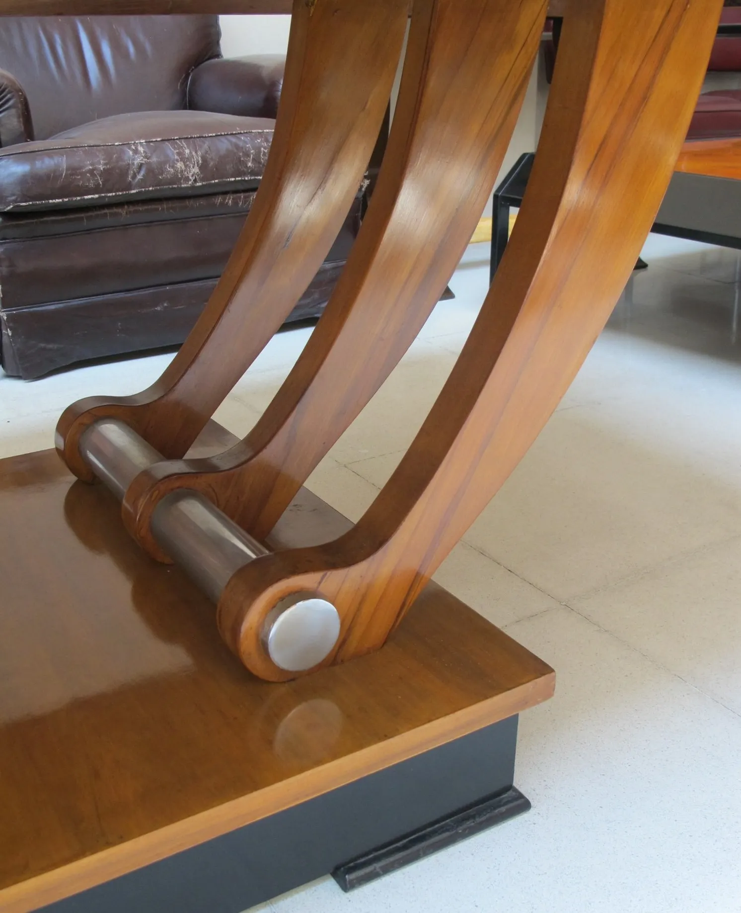 details of an antique dining table base for 12 people in a cozy setting.