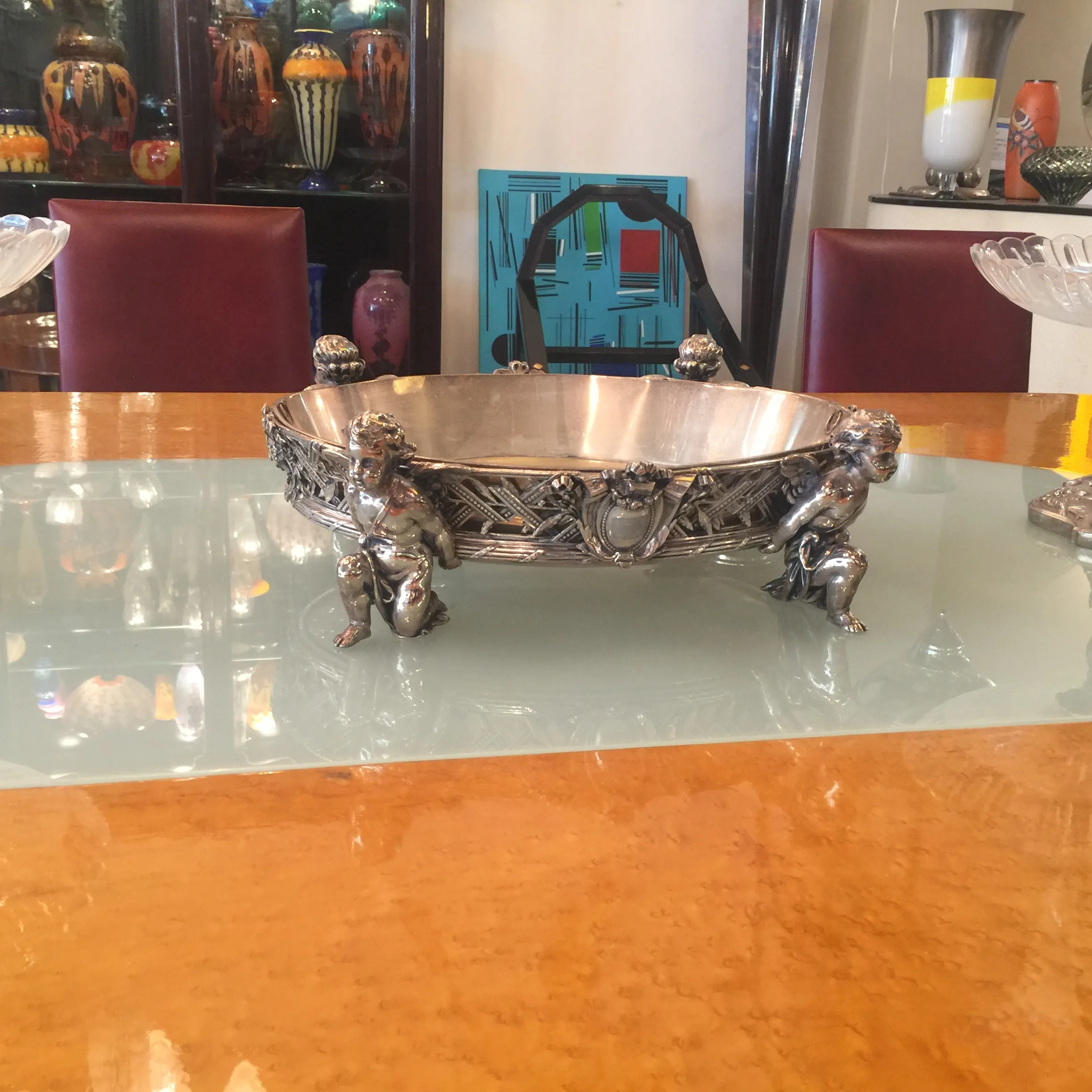 Antique dining table with decorative figures, Art Deco style