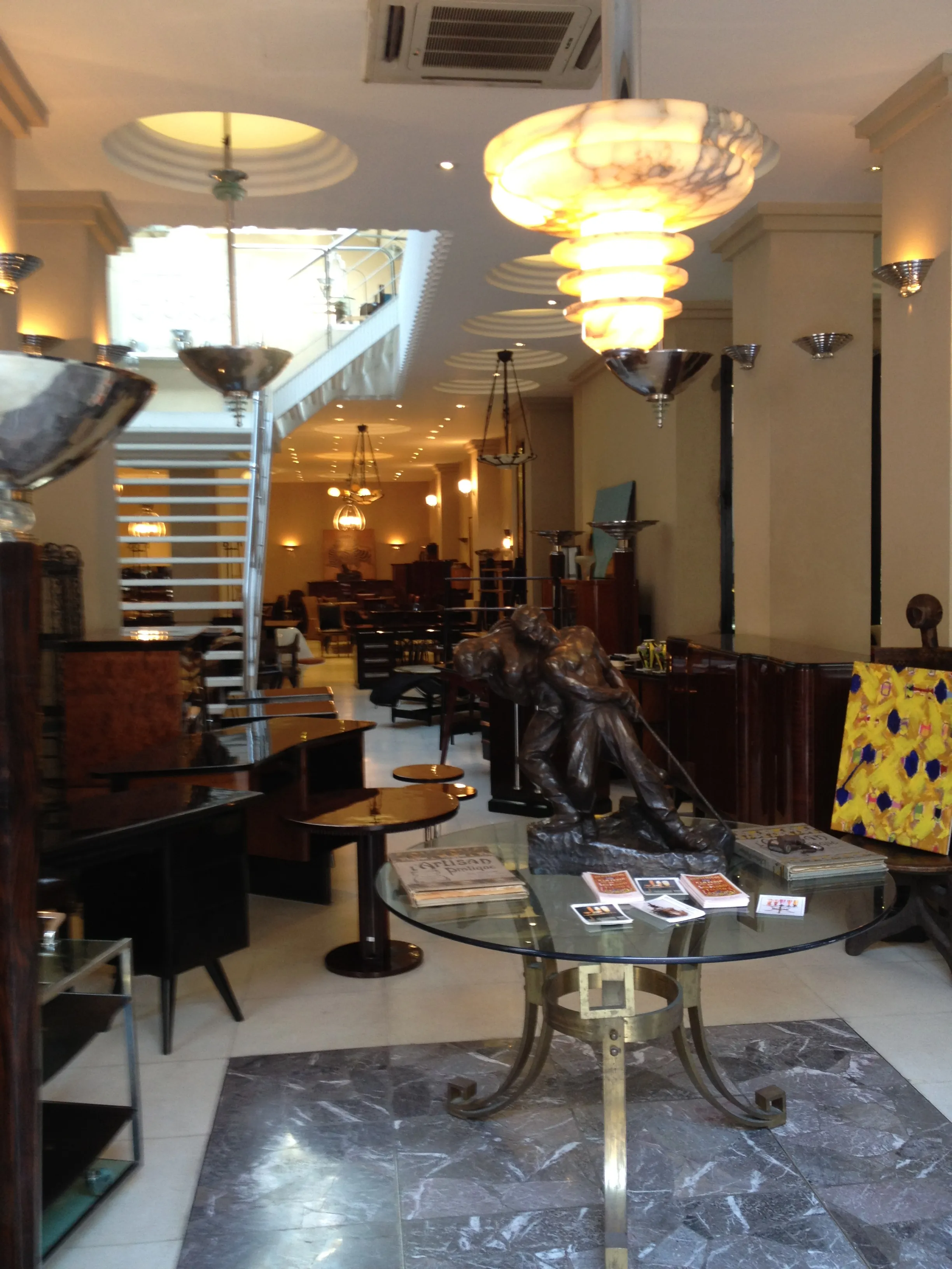 Antique Art Deco dining table for 4 in an elegant setting with sophisticated decor.