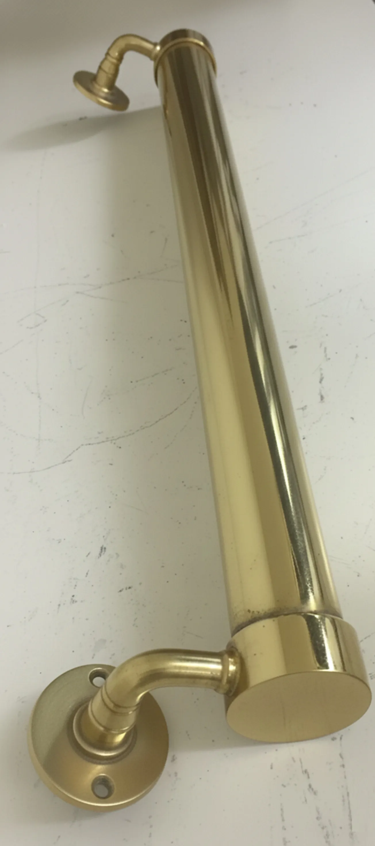 antique shiny door handle with curved design