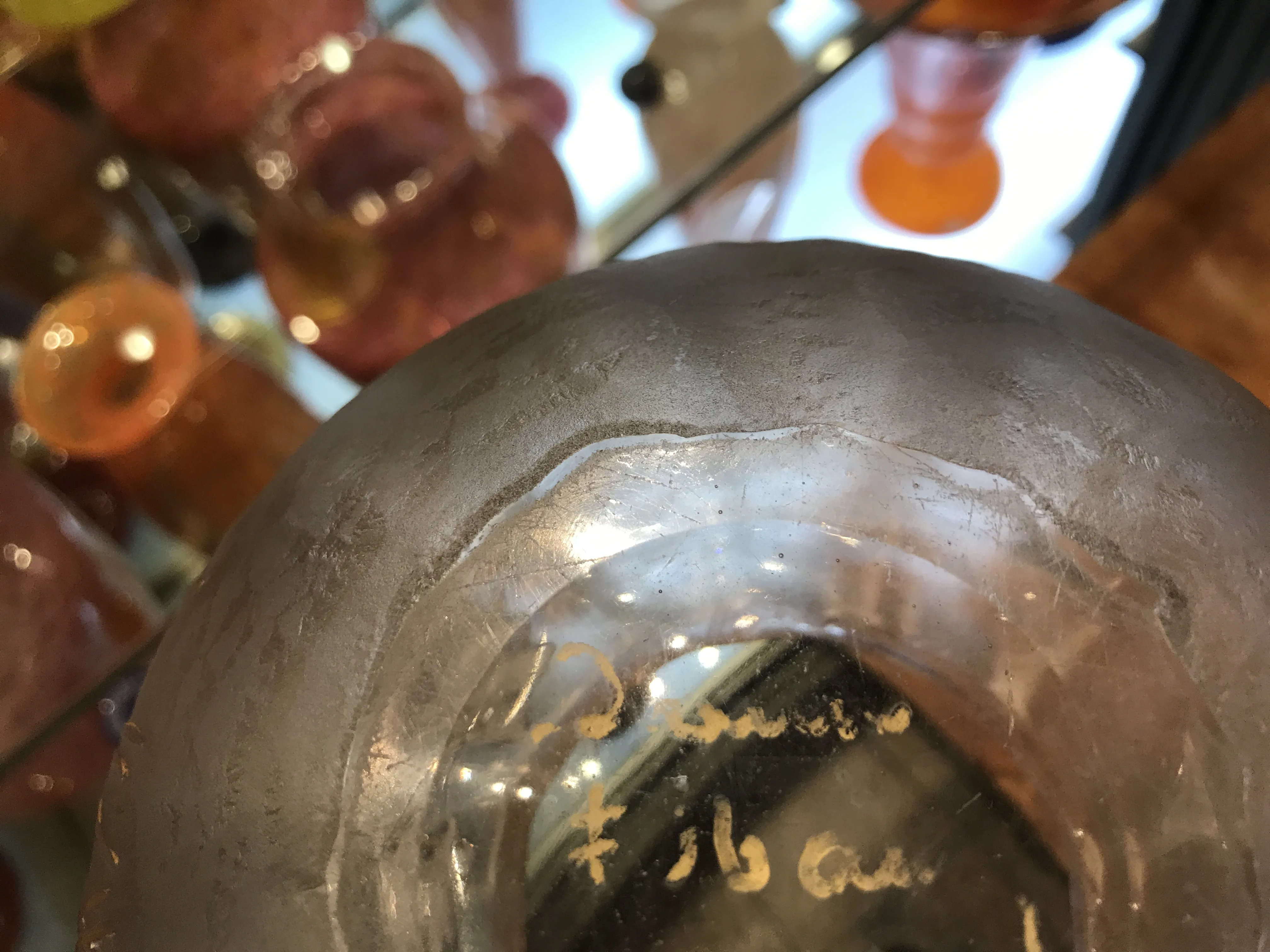 selo antigo daum nancy com inscrições visíveis