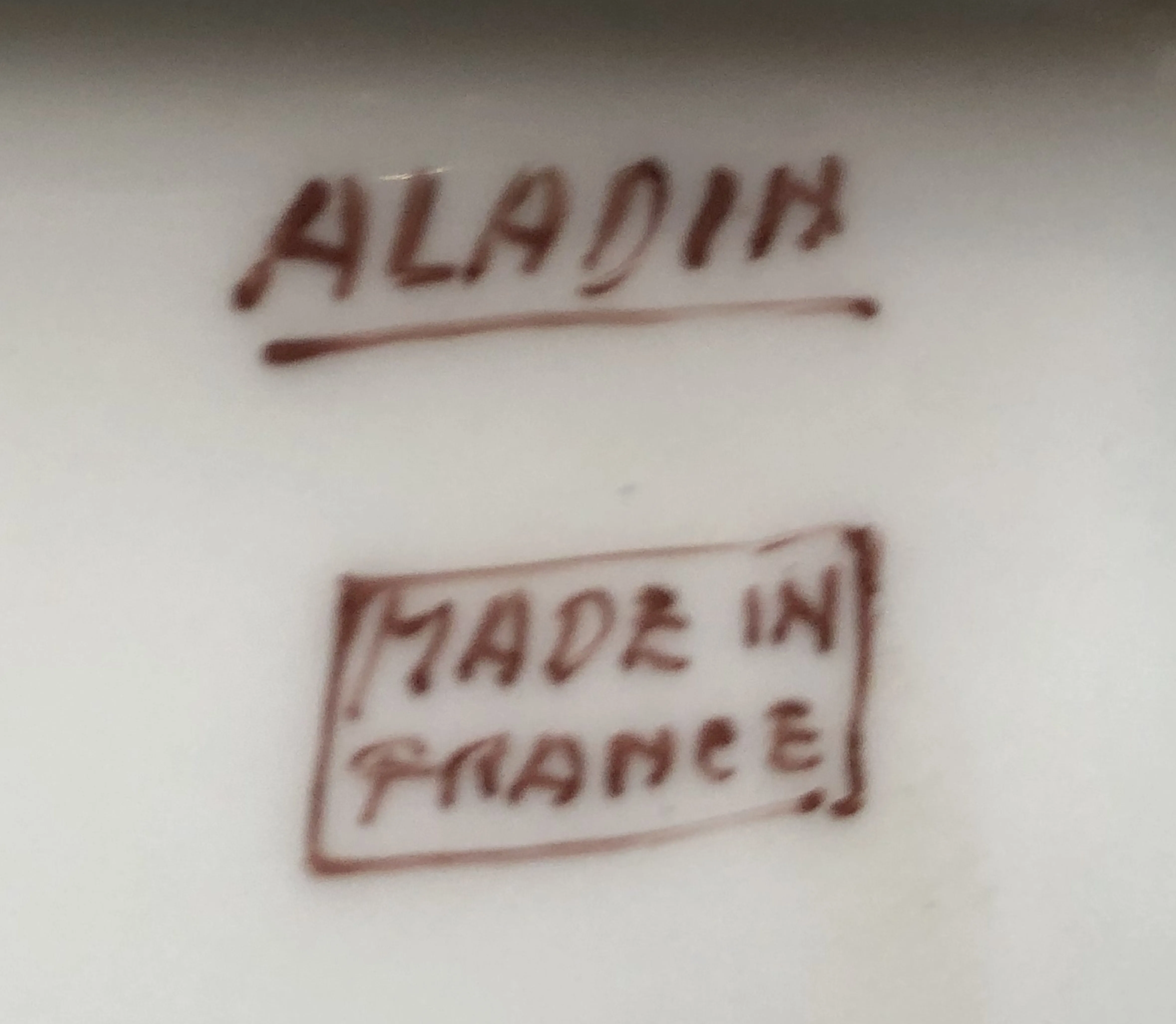 selo antigo com inscrição Aladin Made in France