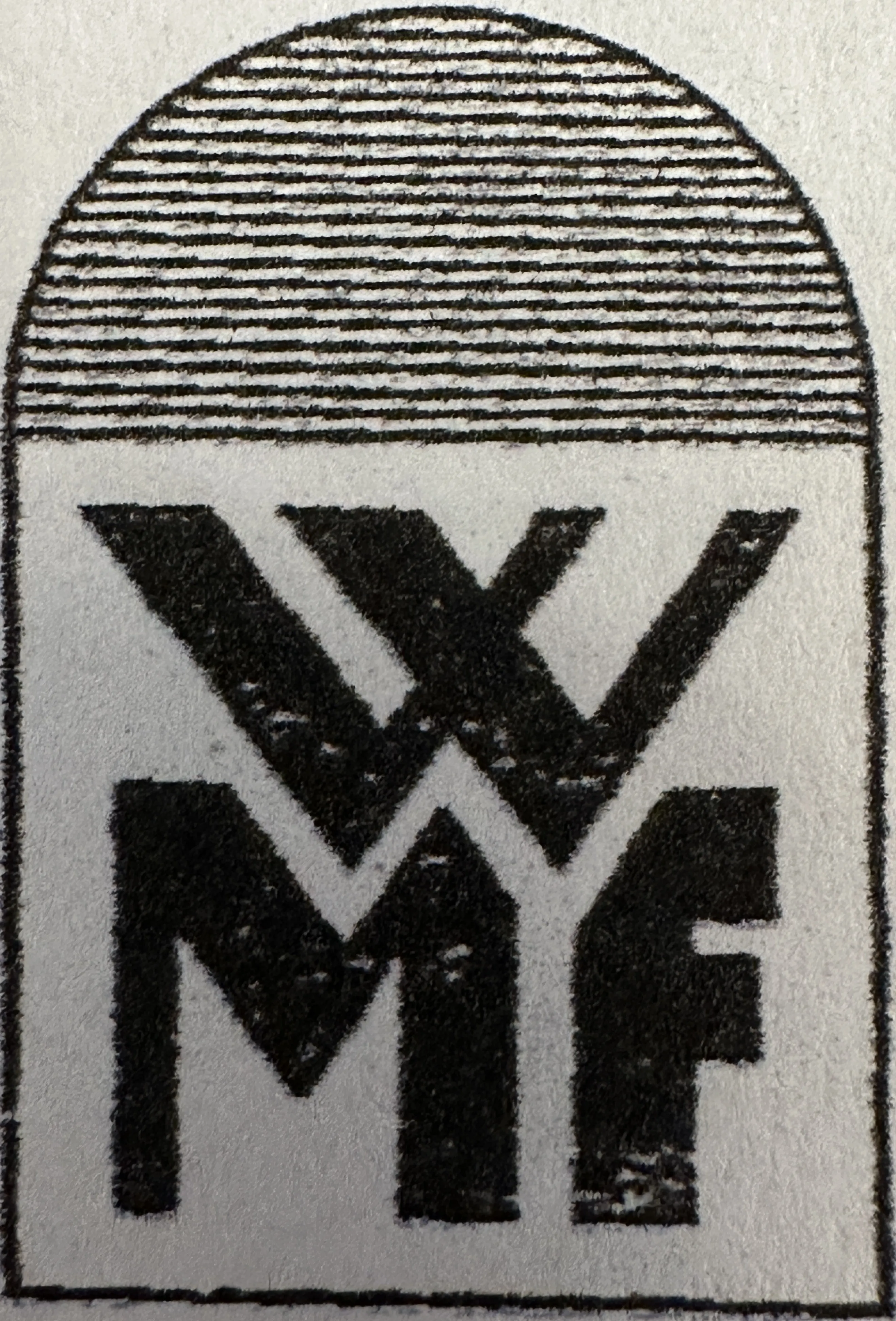 altes Siegel mit WMF-Marke, zeigt Nutzungsspuren