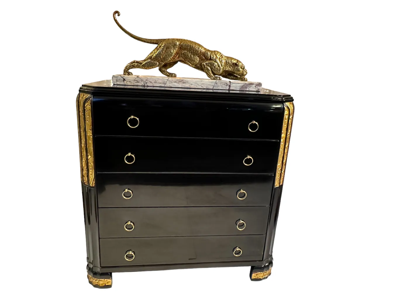 Antique black cabinet with golden accents and a golden figure on top.