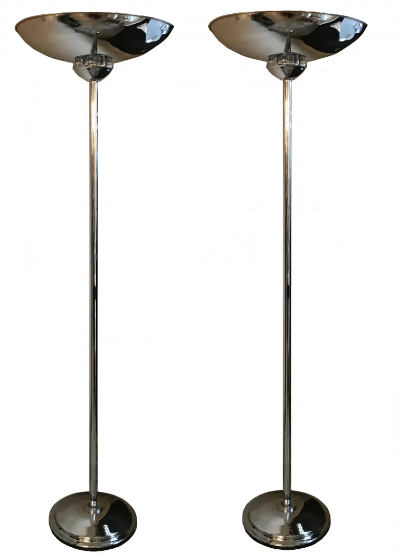 two elegant antique floor lamps, shiny and stylish, in a cozy setting.