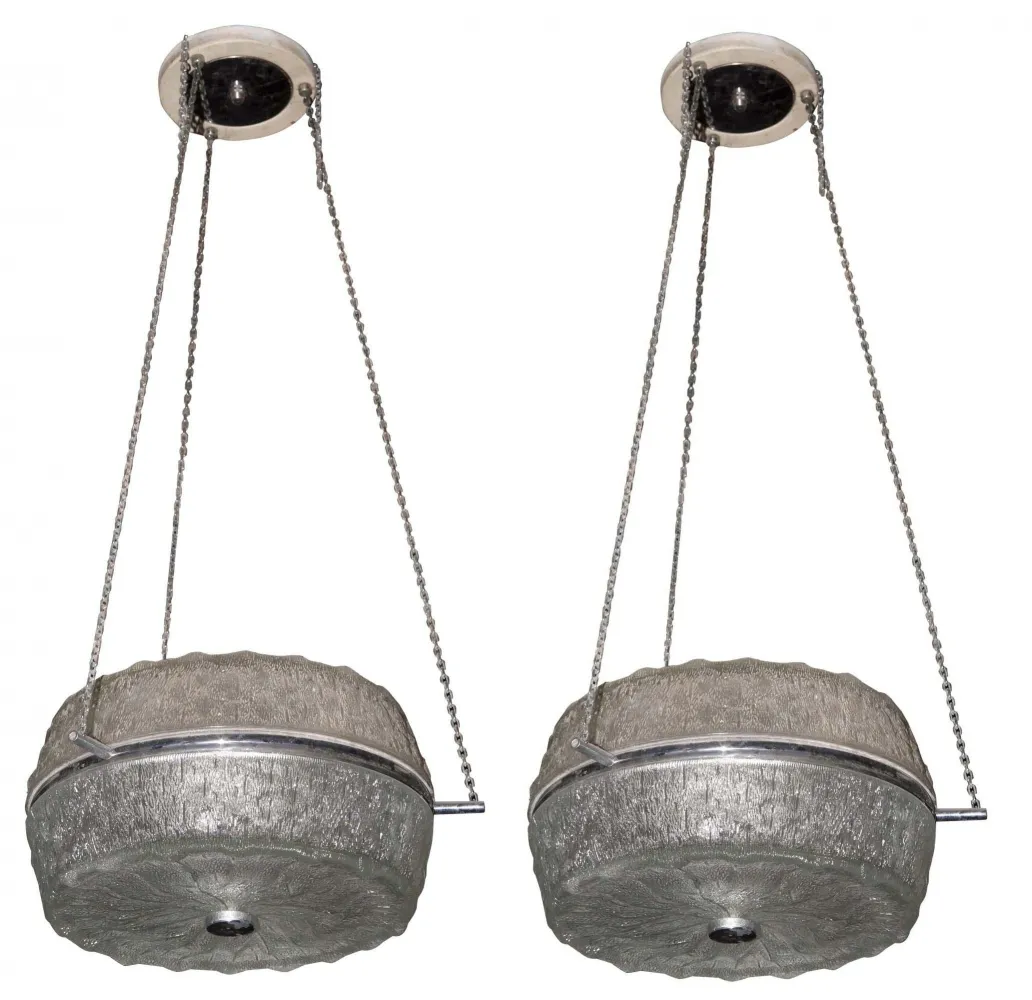 two antique hanging lamps in a decorative setting