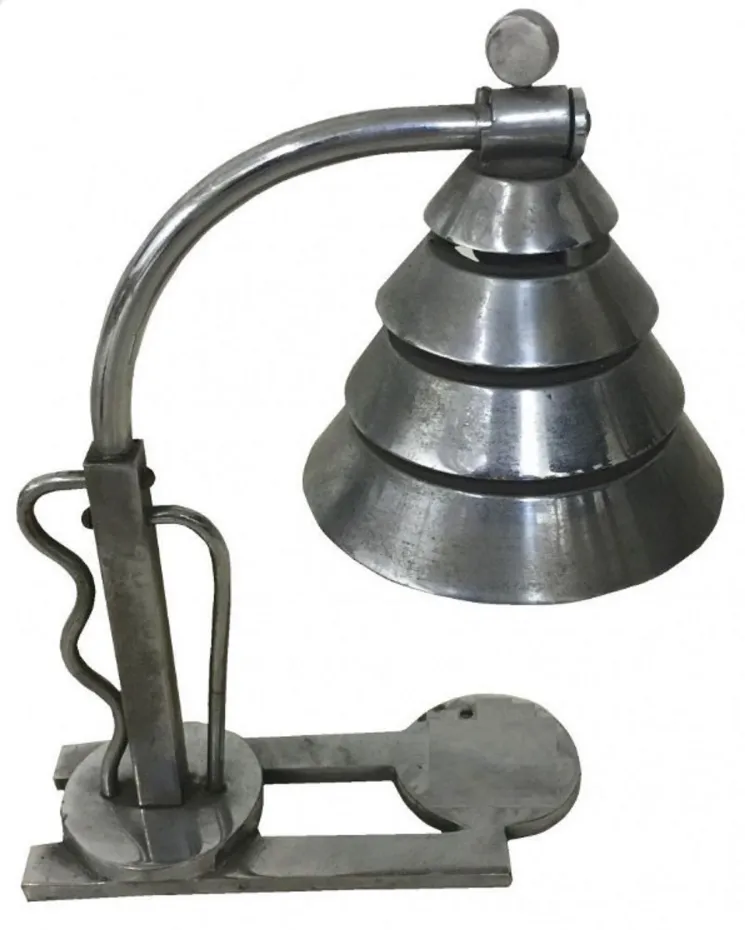 antique table lamp with contemporary design, metallic finish, part of an elegant setting