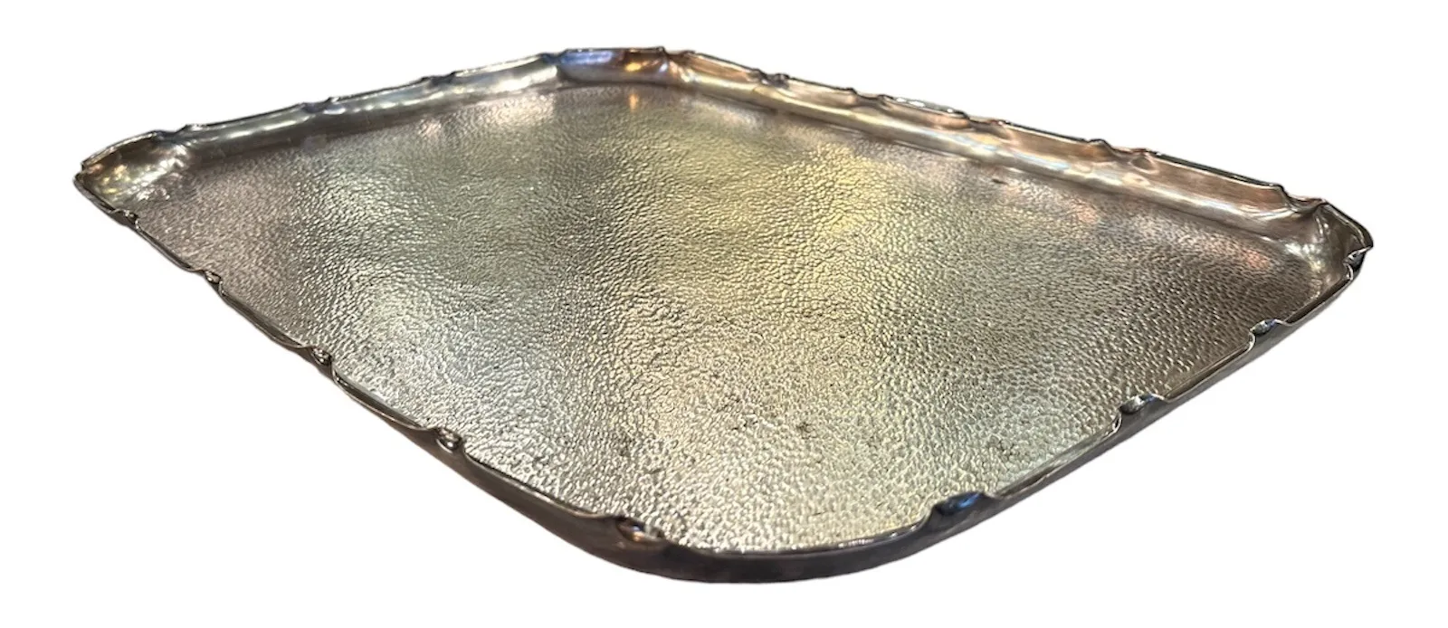 antique tray with decorative edges and textured surface