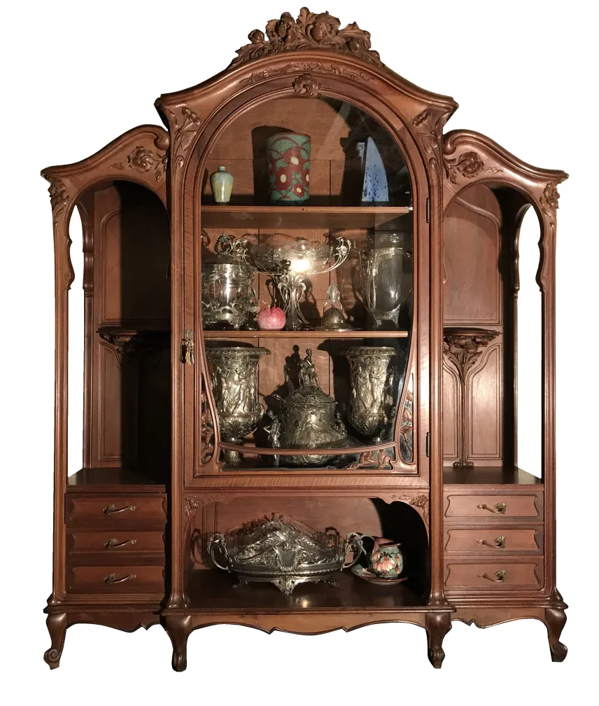 Antique display cabinet E.Dienst - Paris showcasing decorative items.