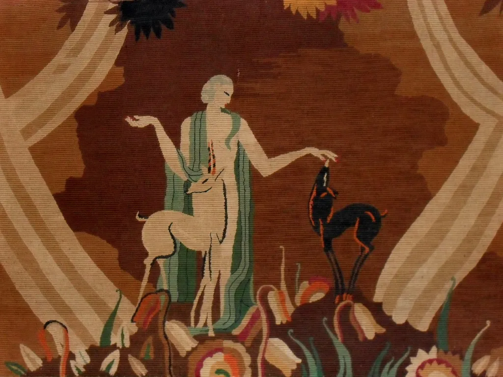 antique tapestry featuring deer and dog in decorative background