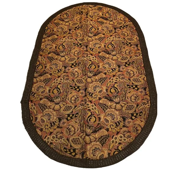 antique tablecloth with floral decorative design in warm tones