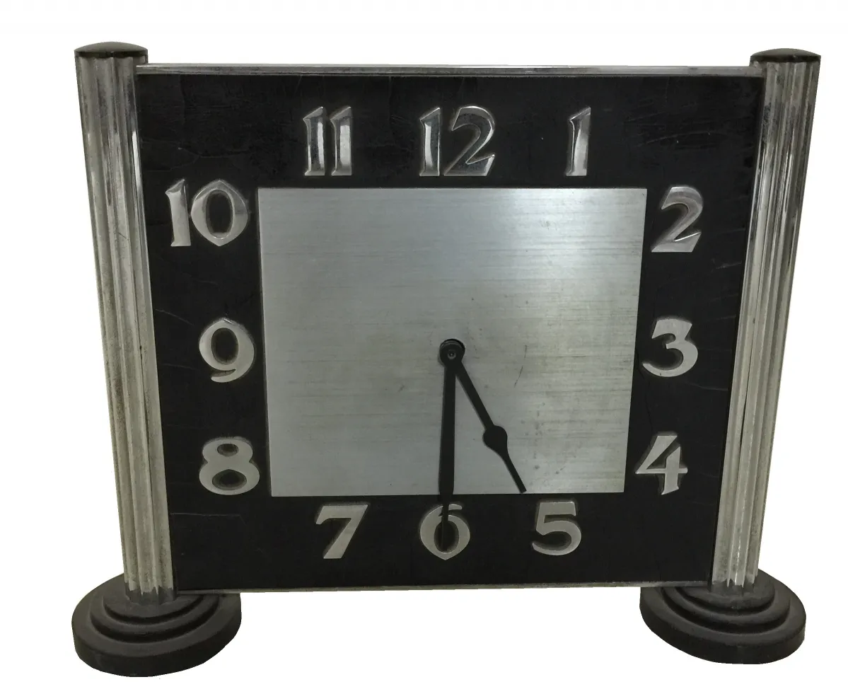 antique black table clock with large numbers