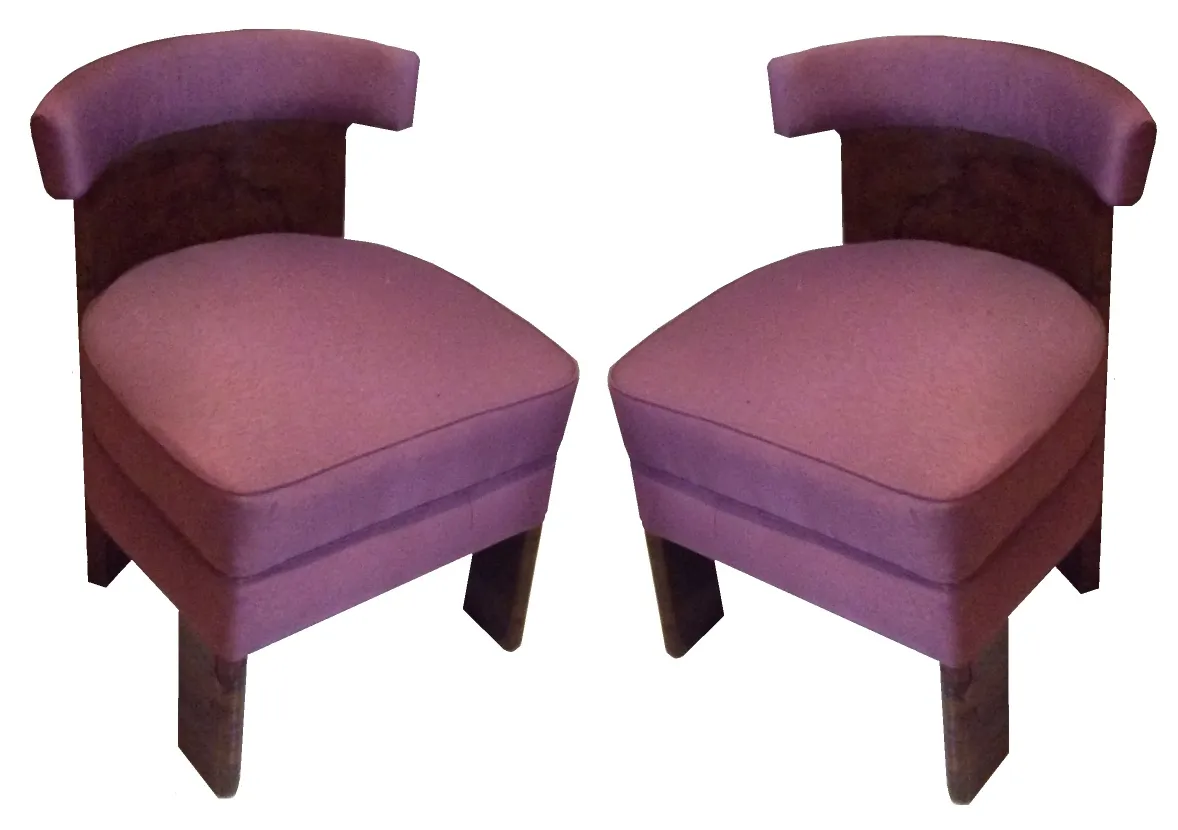 two antique armchairs in a neutral setting, ready for restoration.