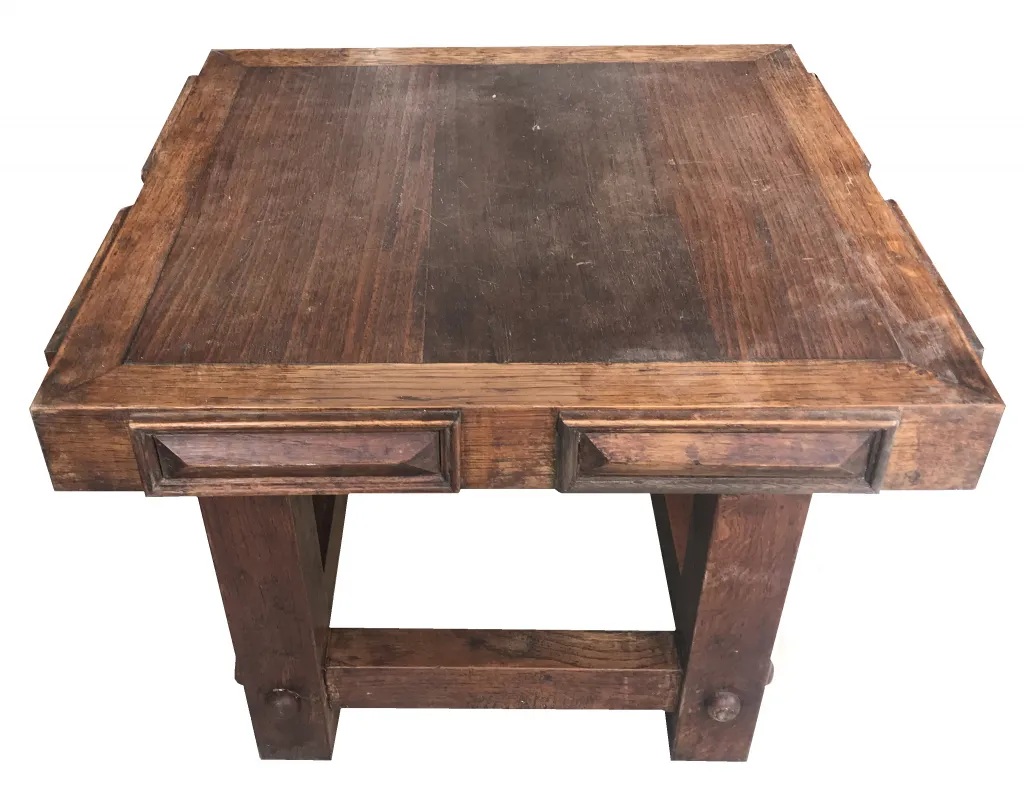 antique coffee table with classic design, featuring worn surface and drawers