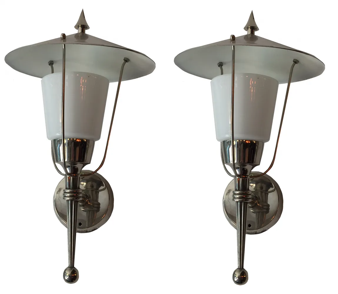 Antique pair of sconces with classic design and light tones