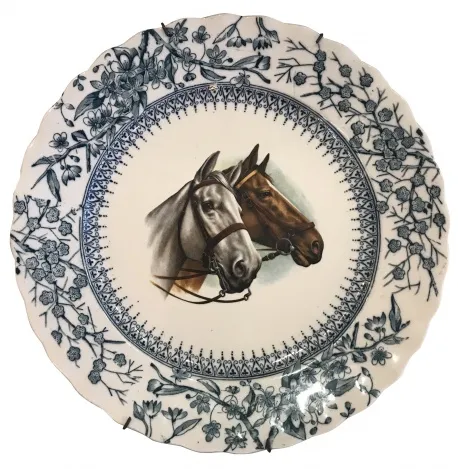 Antique ceramic plate featuring horses and floral design