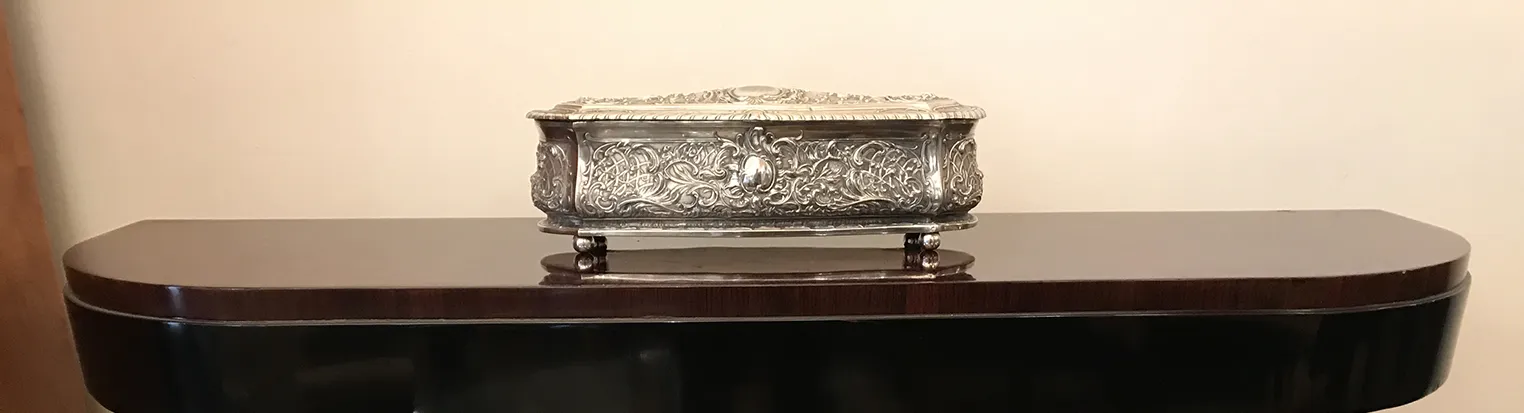 Antique decorative jewelry box with intricate details, elegant setting.