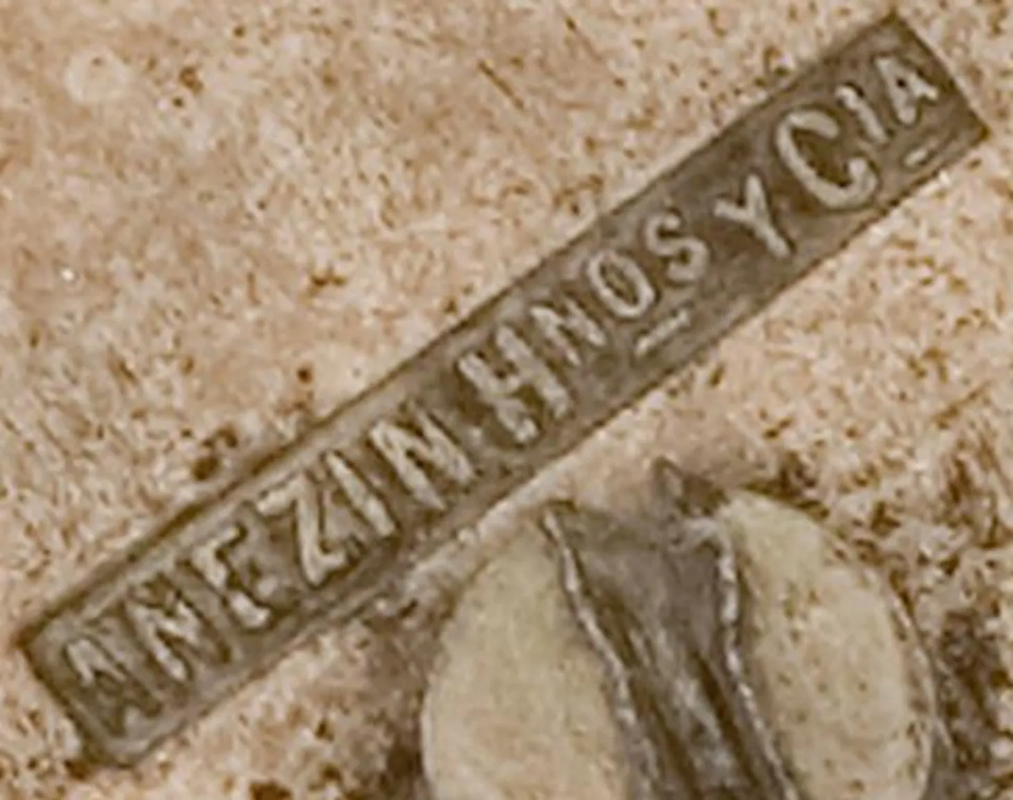 detail of an antique seal with anezin hnos y cia